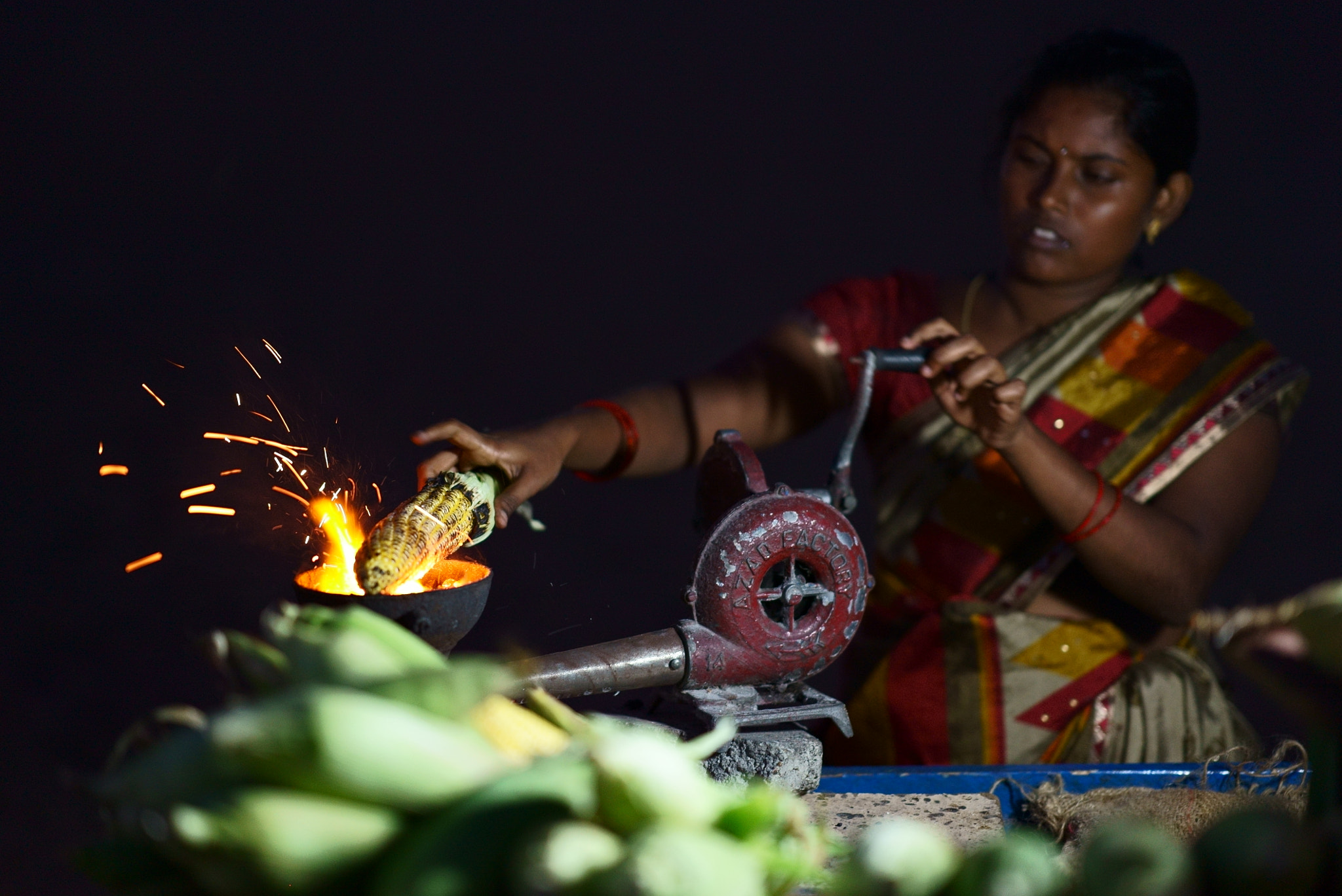 Sony a7S sample photo. Cooking corn on the beach photography