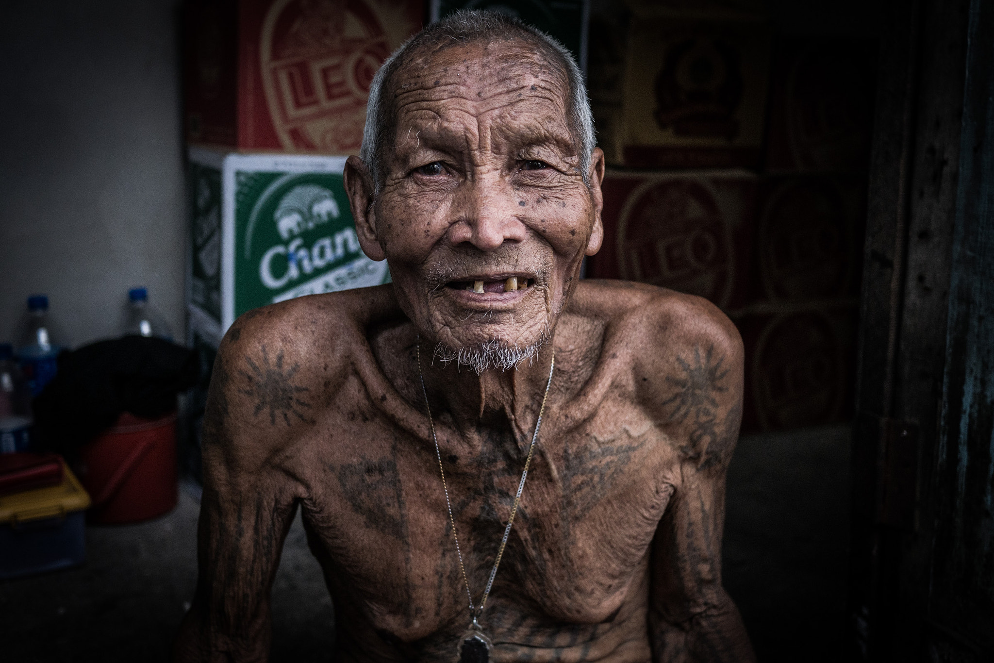 Panasonic Lumix DMC-GX7 + LUMIX G 20/F1.7 II sample photo. Old man outside his house in bangkok photography