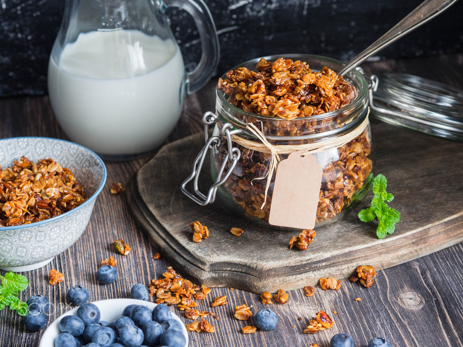 Olympus OM-D E-M10 sample photo. Baked granola and berries in small bowls.. photography