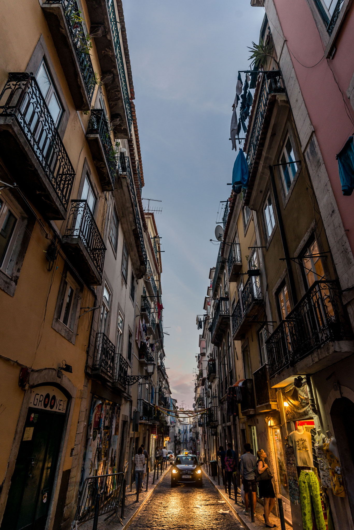 Nikon D600 + Nikon AF-S Nikkor 20mm F1.8G ED sample photo. Headlights in a narrow alley photography