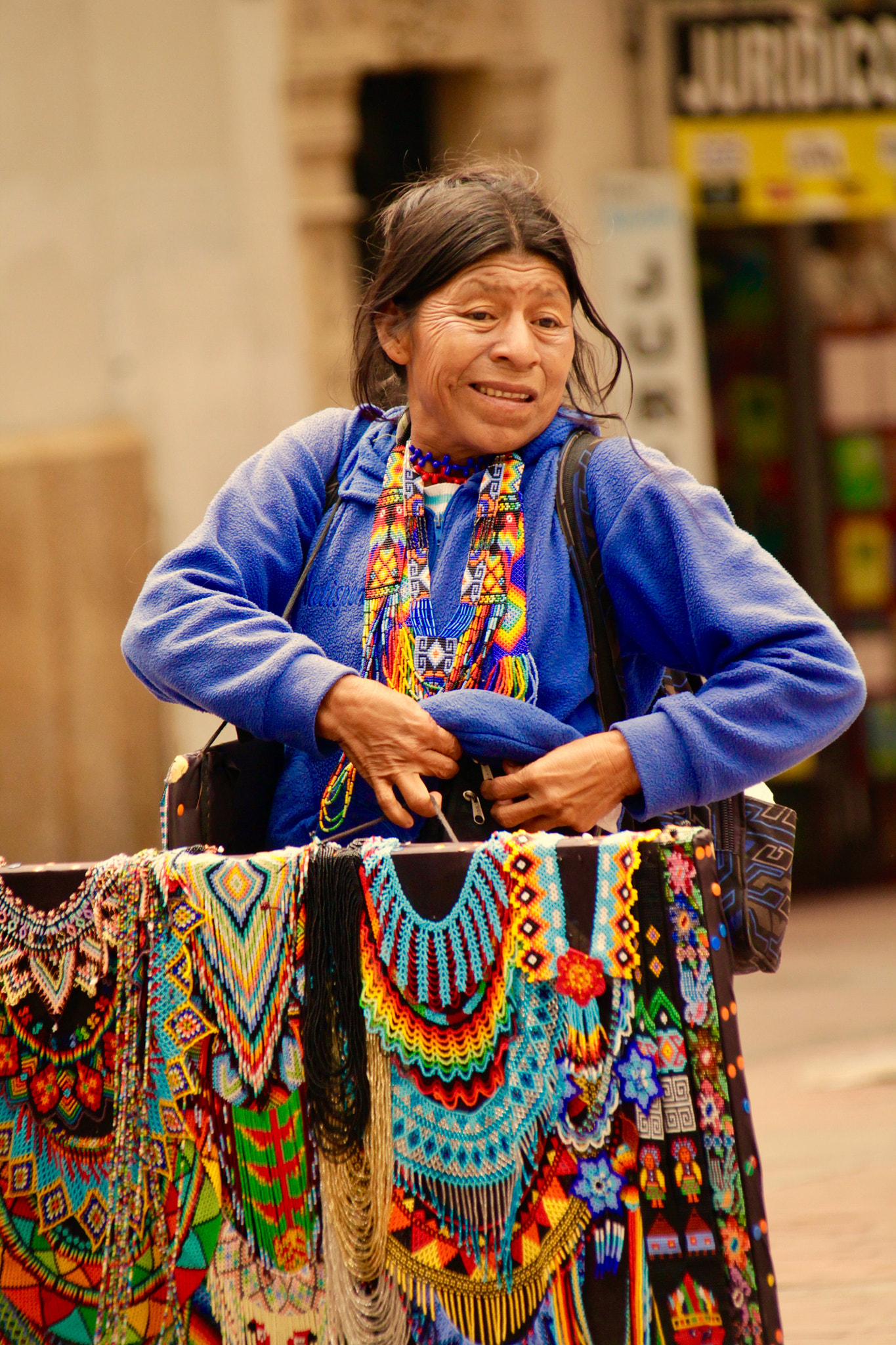 Canon EF 75-300mm F4.0-5.6 IS USM sample photo. Woman selling handcraft photography