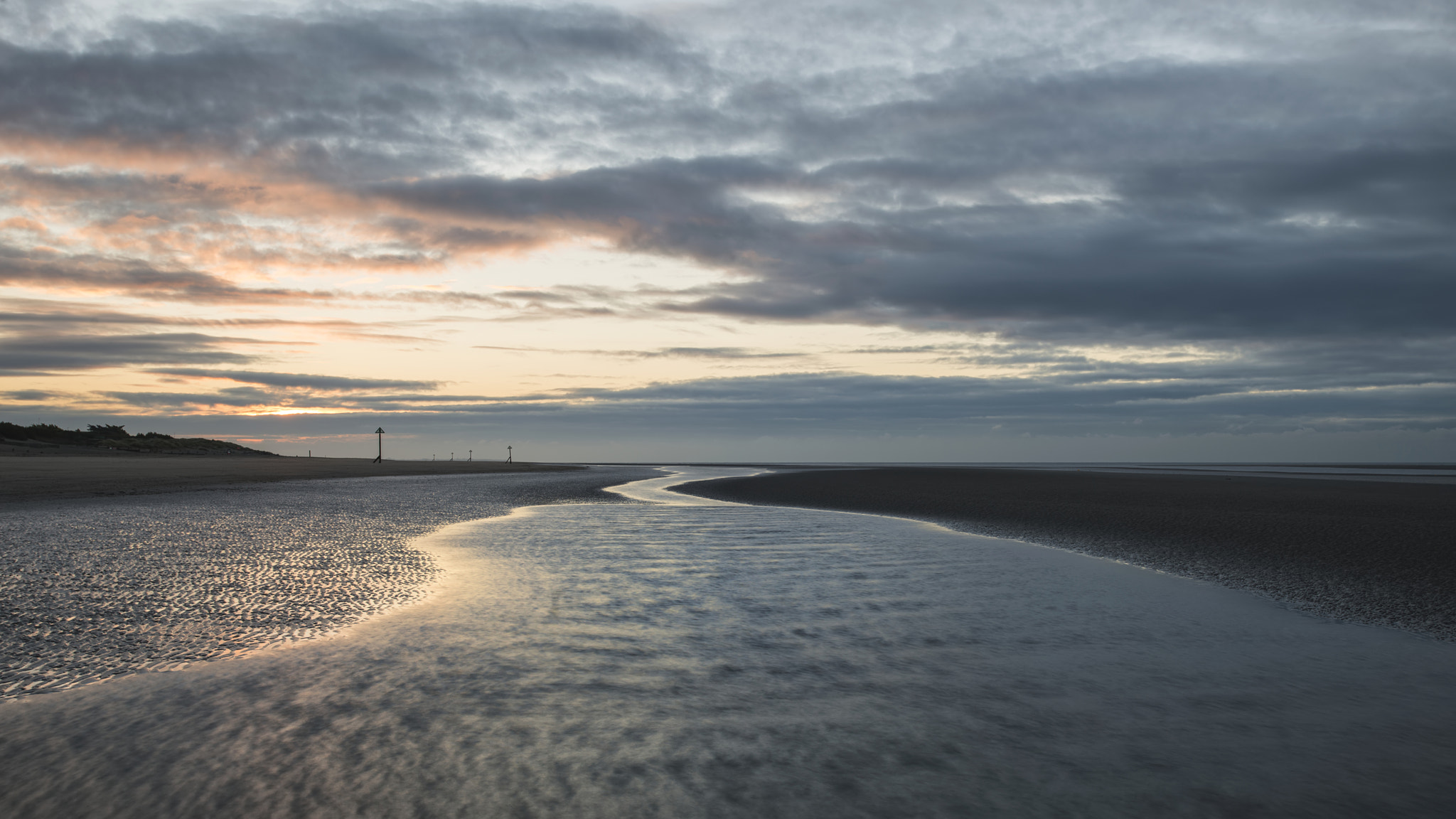 Nikon AF-S Nikkor 18-35mm F3.5-4.5G ED sample photo. Stunning colorful winter sunrise over low tide beach photography