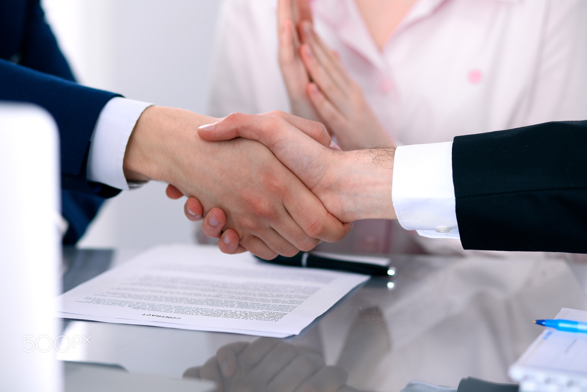 Business people shaking hands finishing up a meeting