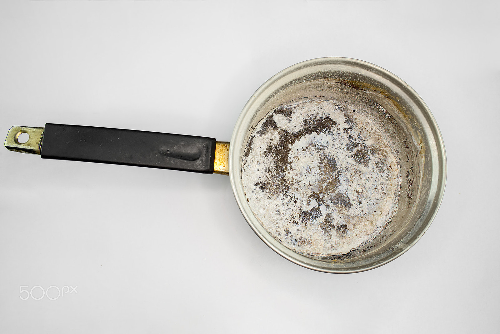 Nikon D610 sample photo. Pan burnt food white background photography