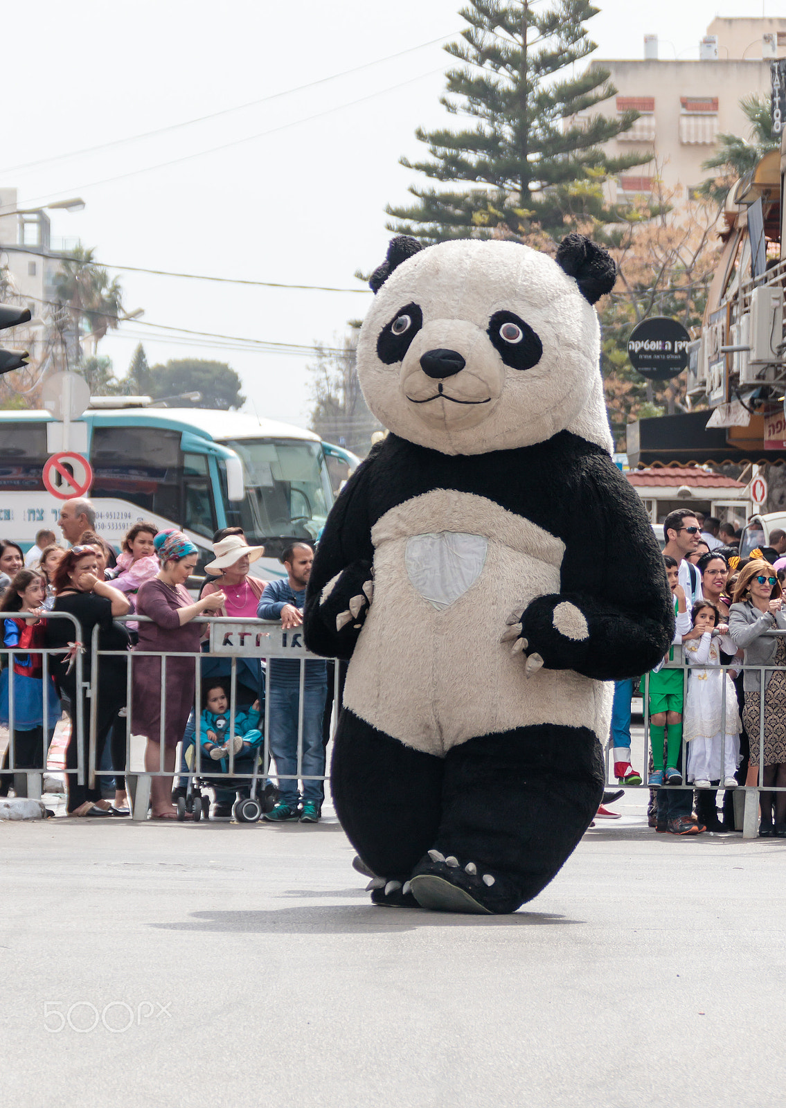 Canon EF 75-300mm F4.0-5.6 IS USM sample photo. Participant in carnival dressed as panda goes near the viewers photography