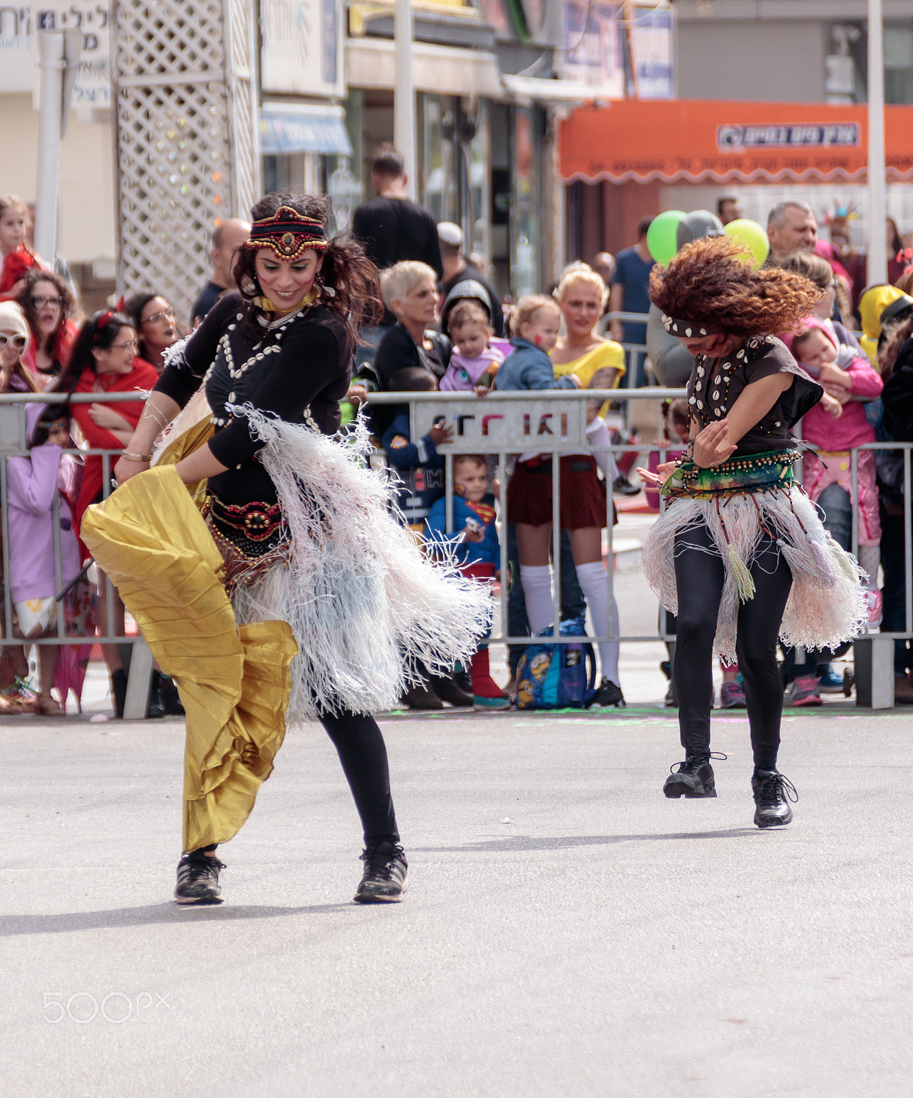 Canon EOS 80D + Canon EF 75-300mm F4.0-5.6 IS USM sample photo. Dancers in exotic costume dancing near the viewers on street photography