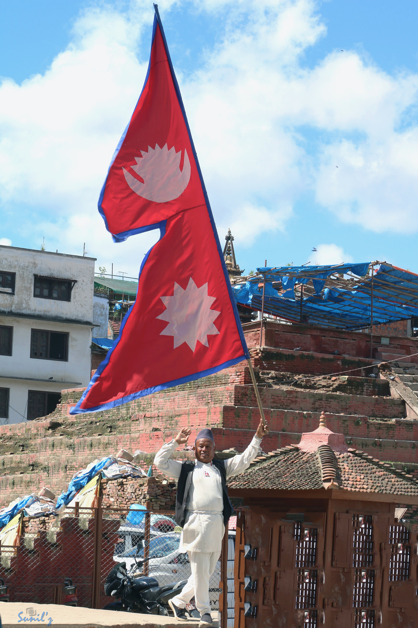 Canon EF-S 55-250mm F4-5.6 IS II sample photo. The nepali flag man photography