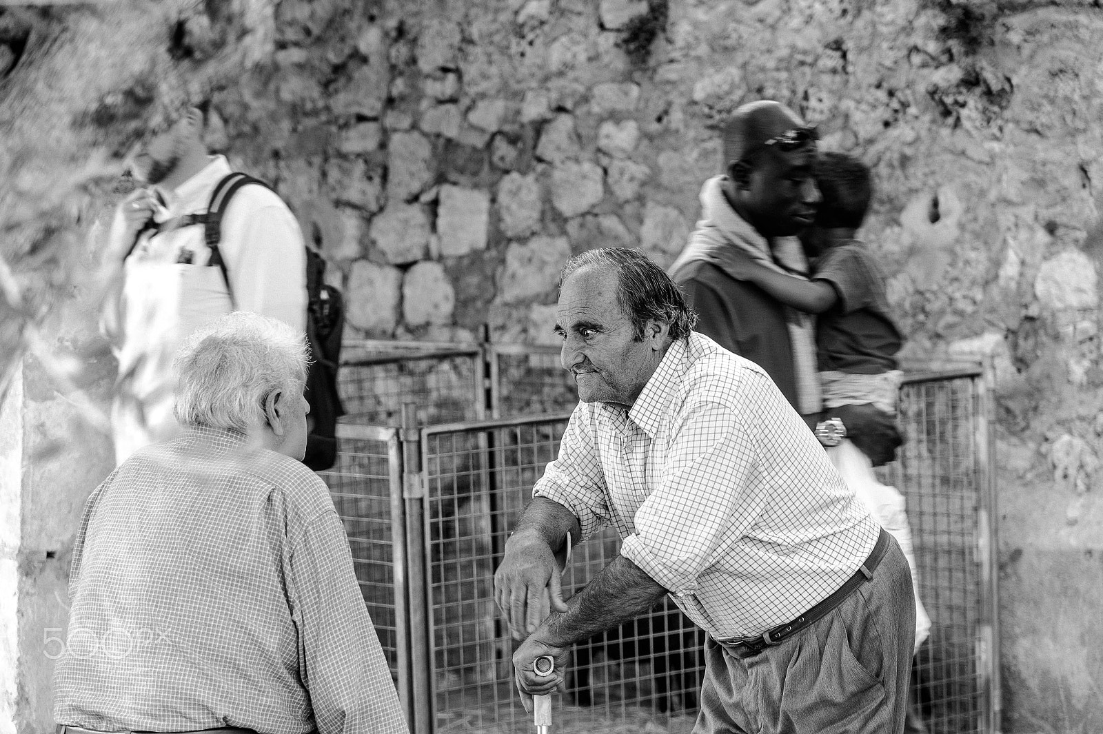Nikon D4 sample photo. Old men talking at the market photography