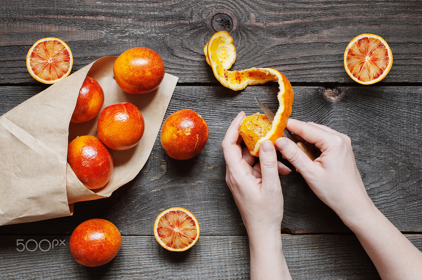 Nikon D700 sample photo. Female hands cut juicy orange photography