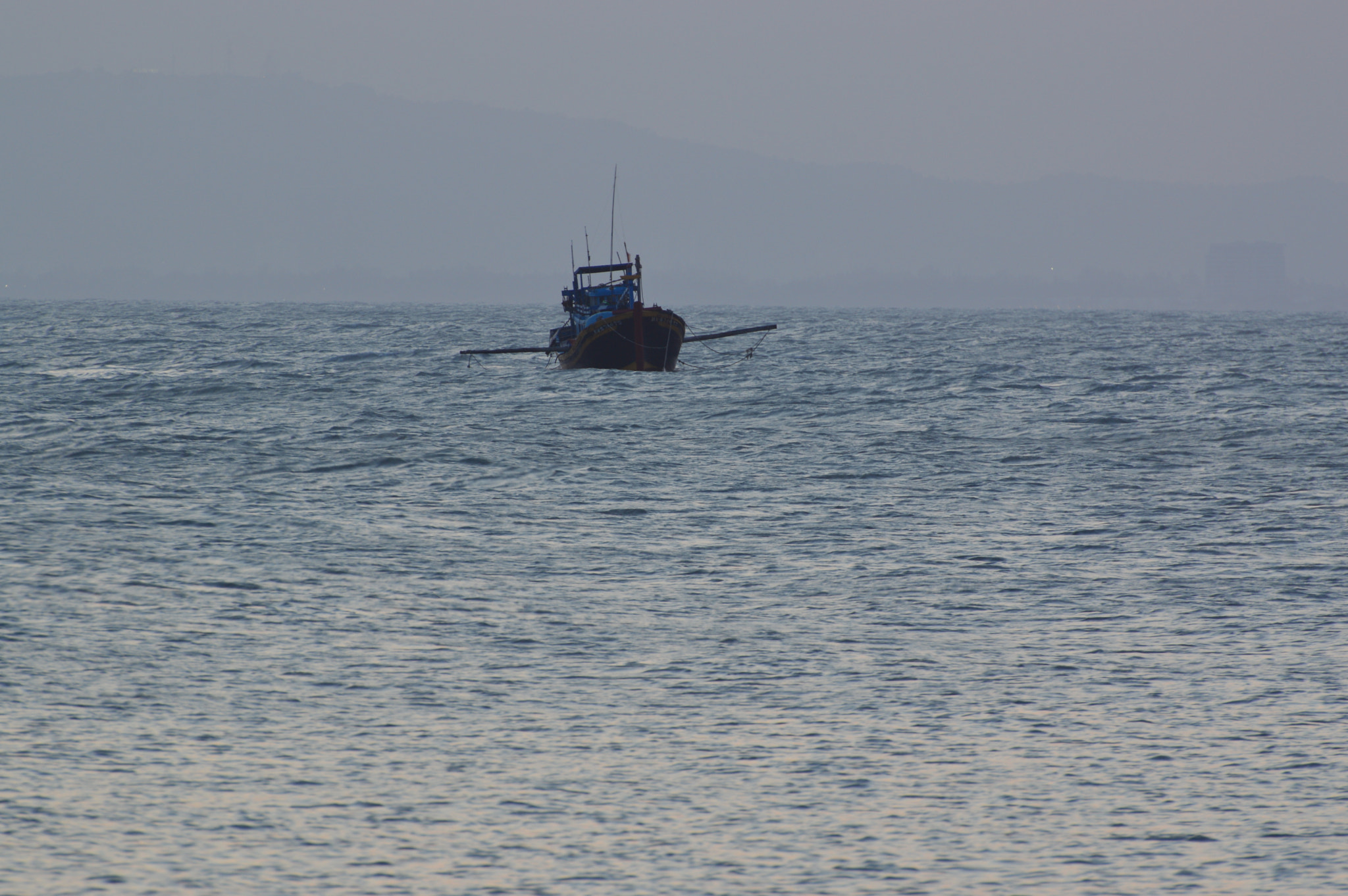 Nikon D3200 sample photo. Solo fishing boat photography