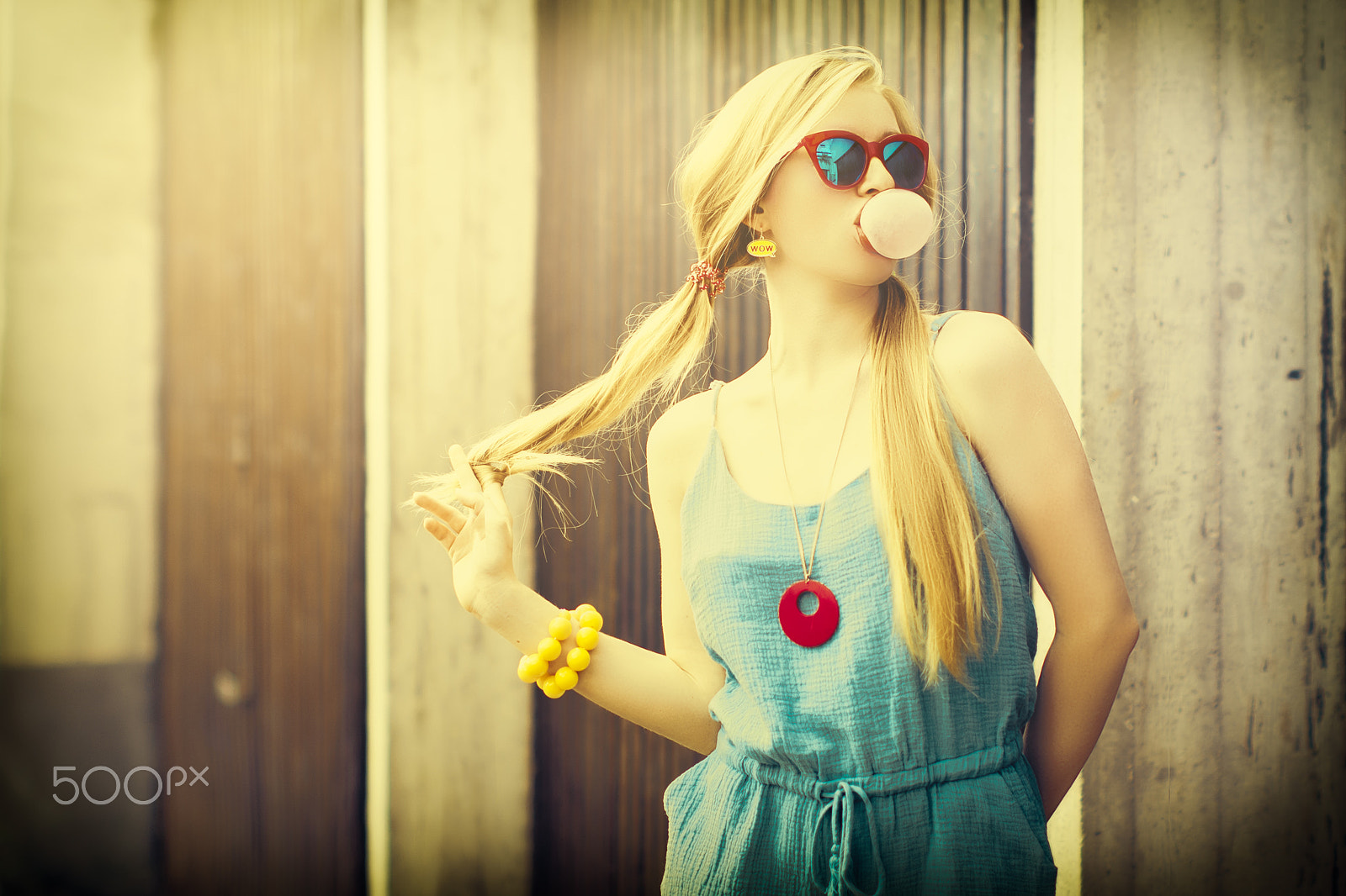 Canon EOS 7D Mark II sample photo. Pretty blond girl chewing gum and making bubbles photography