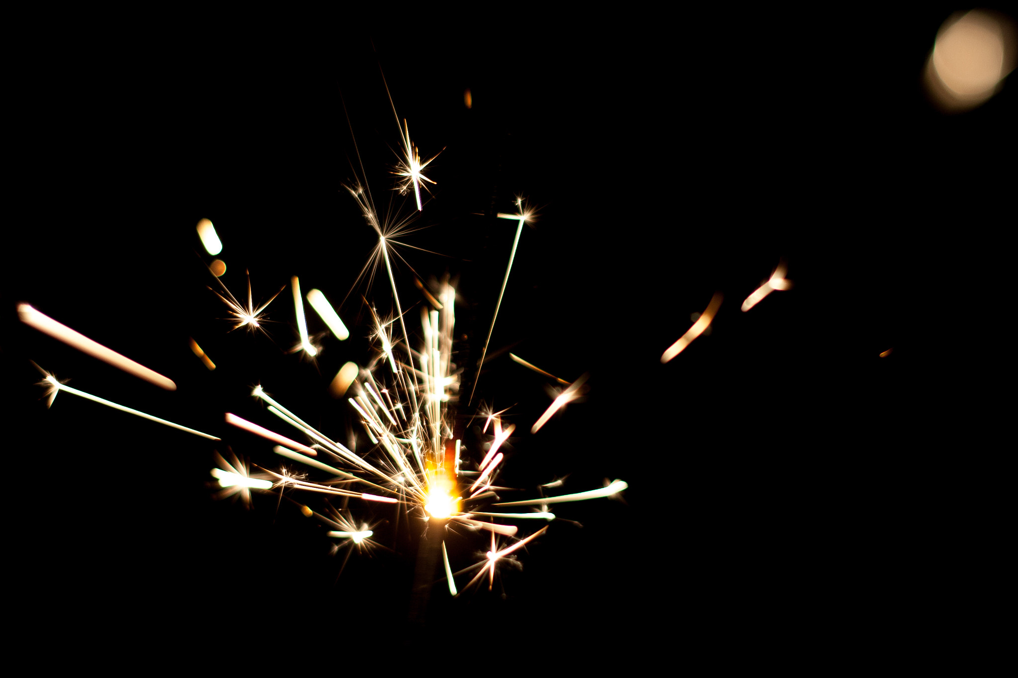 Canon EOS 30D + Canon EF 50mm f/1.8 sample photo. A lit sparkler in darkness photography