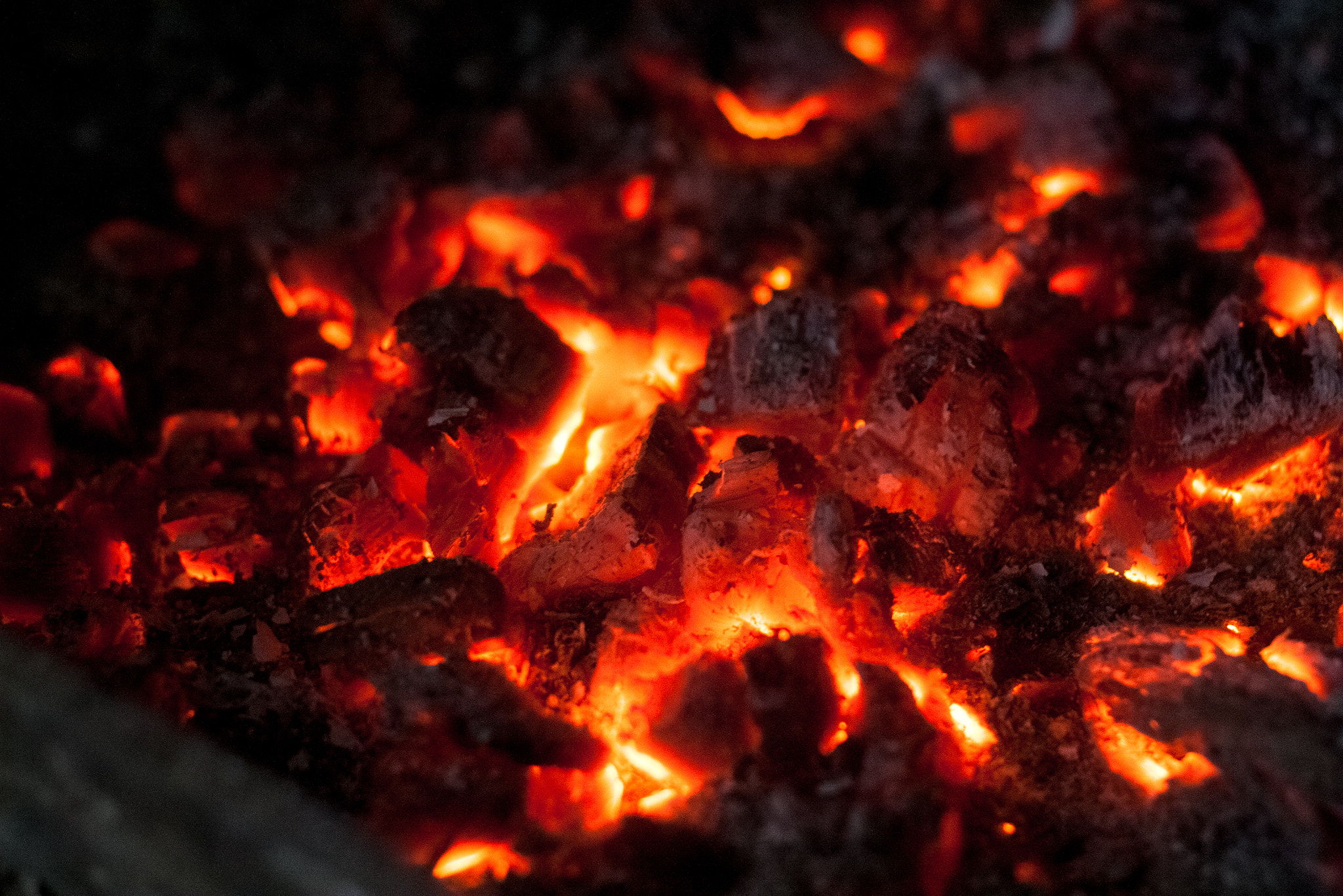 Canon EOS 30D + Canon EF 50mm f/1.8 sample photo. Hot coals in the fireplace. photography