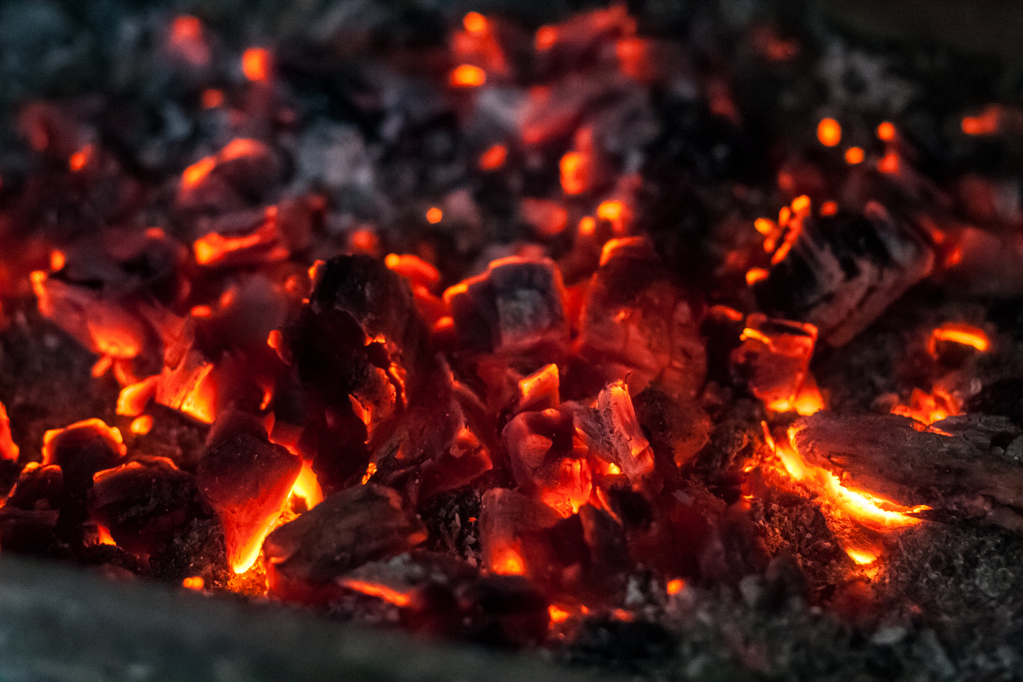 Canon EOS 30D + Canon EF 50mm f/1.8 sample photo. Hot coals in the fireplace. photography