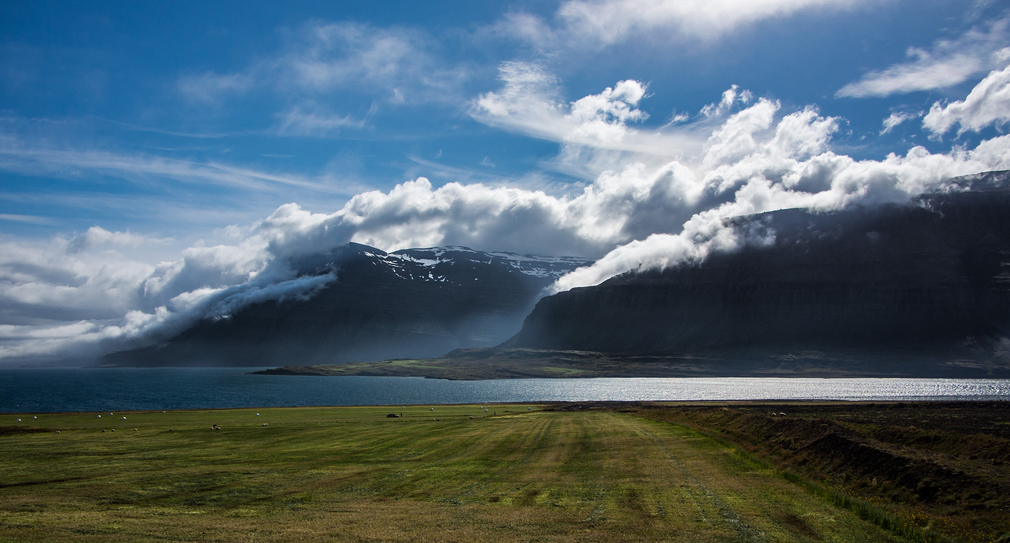 Olympus OM-D E-M5 + Panasonic Lumix G 14mm F2.5 ASPH sample photo. Mountains & clouds photography