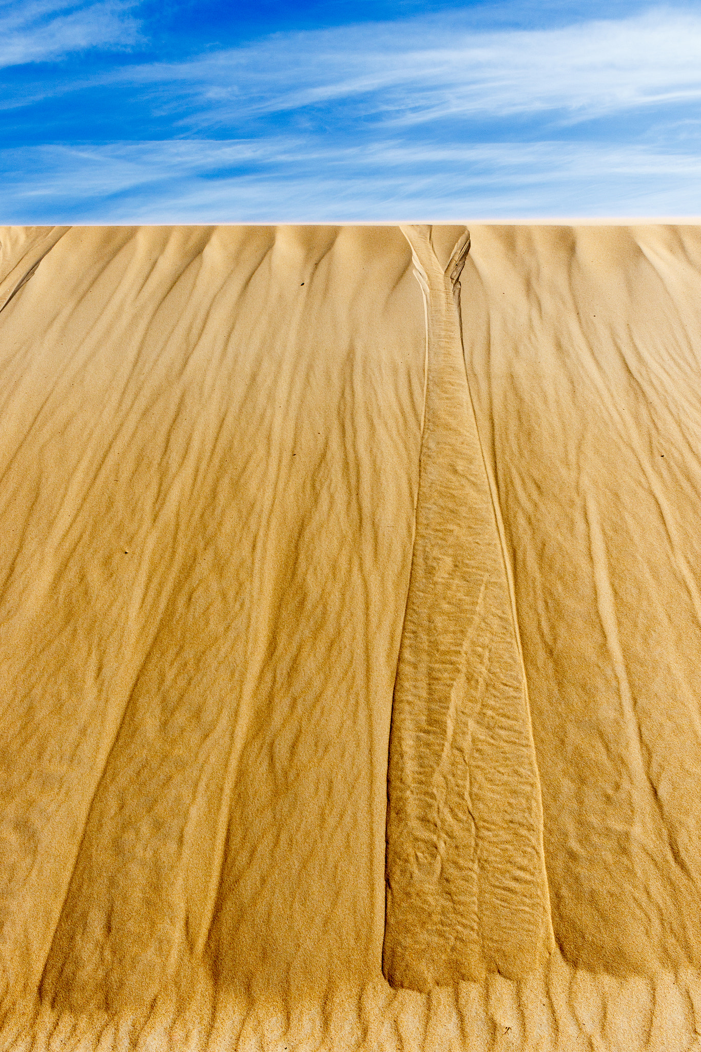 Canon EF-S 24mm F2.8 STM sample photo. Sand dune with the sky in the foreground. photography