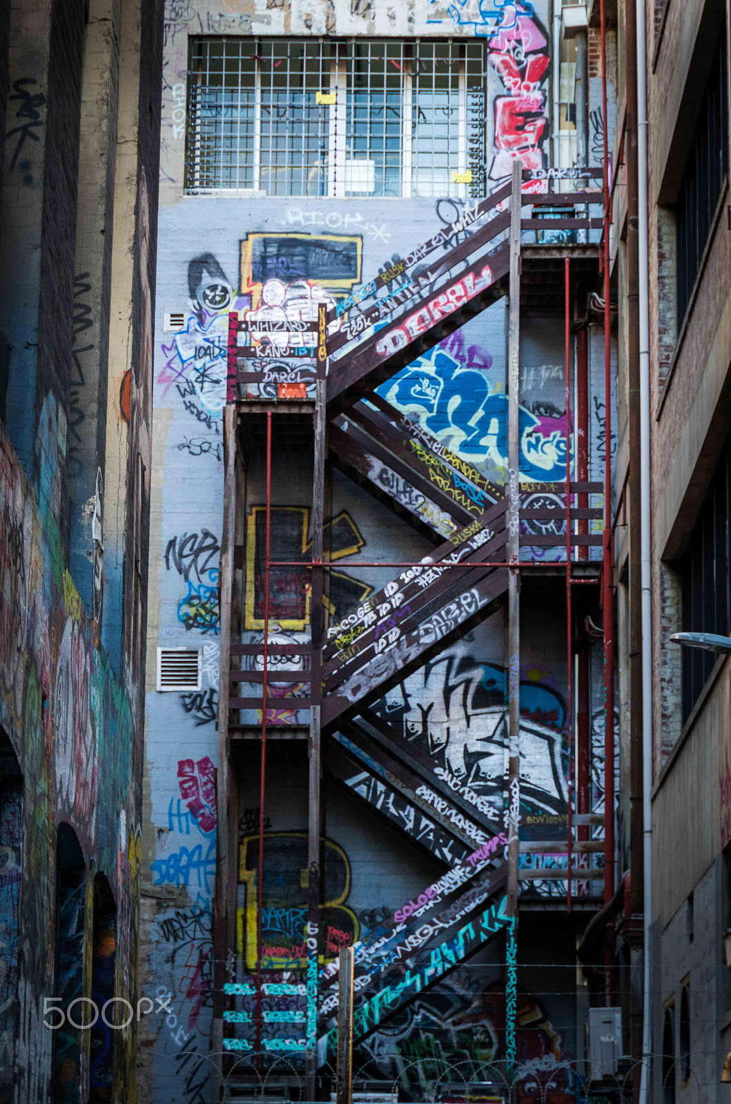 Canon EOS 7D Mark II + Sigma 18-250mm F3.5-6.3 DC OS HSM sample photo. Back alley stairs photography
