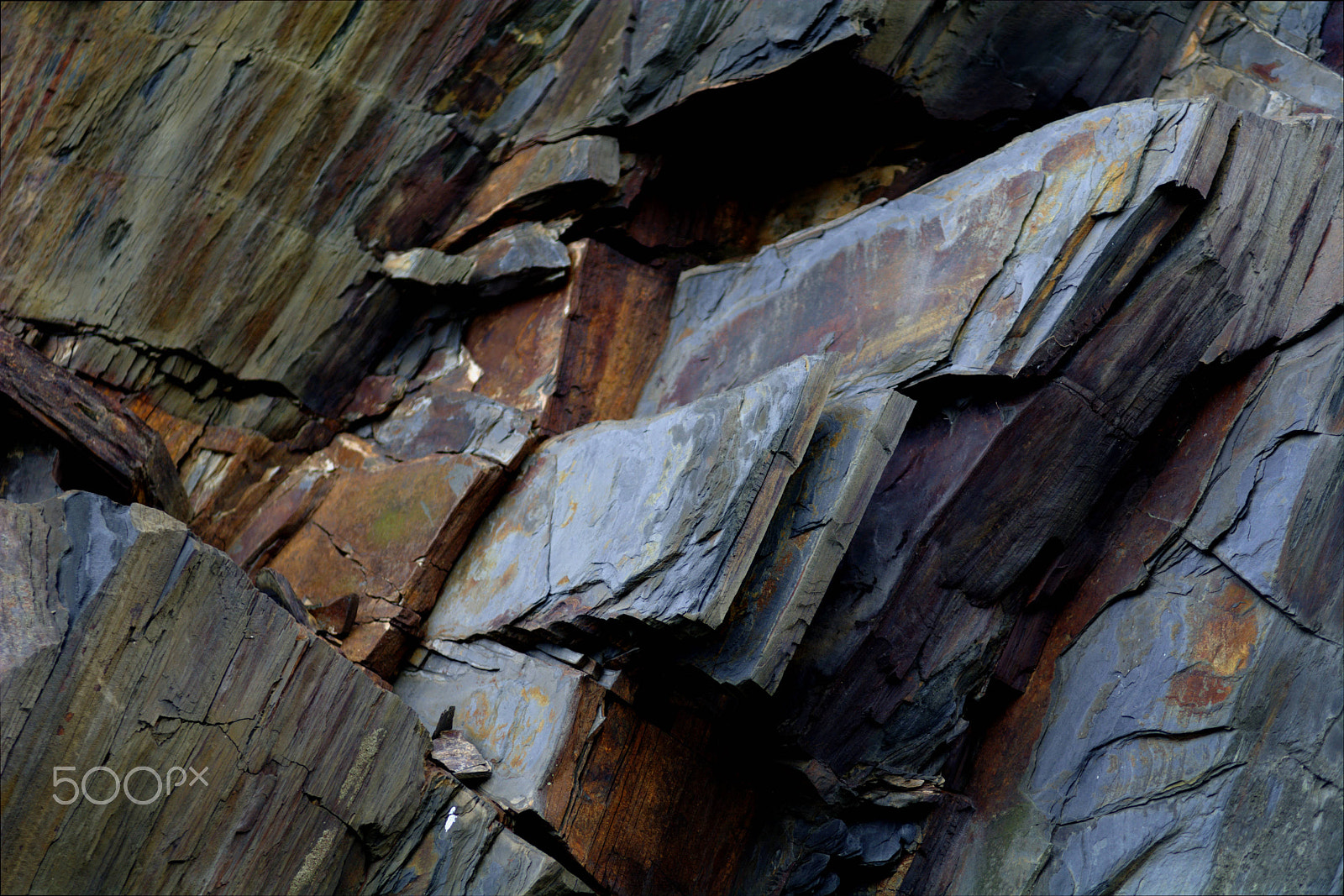 Nikon D7100 + Nikon AF-Nikkor 80-200mm F2.8D ED sample photo. Layers of slate ready to fall from a cliff photography