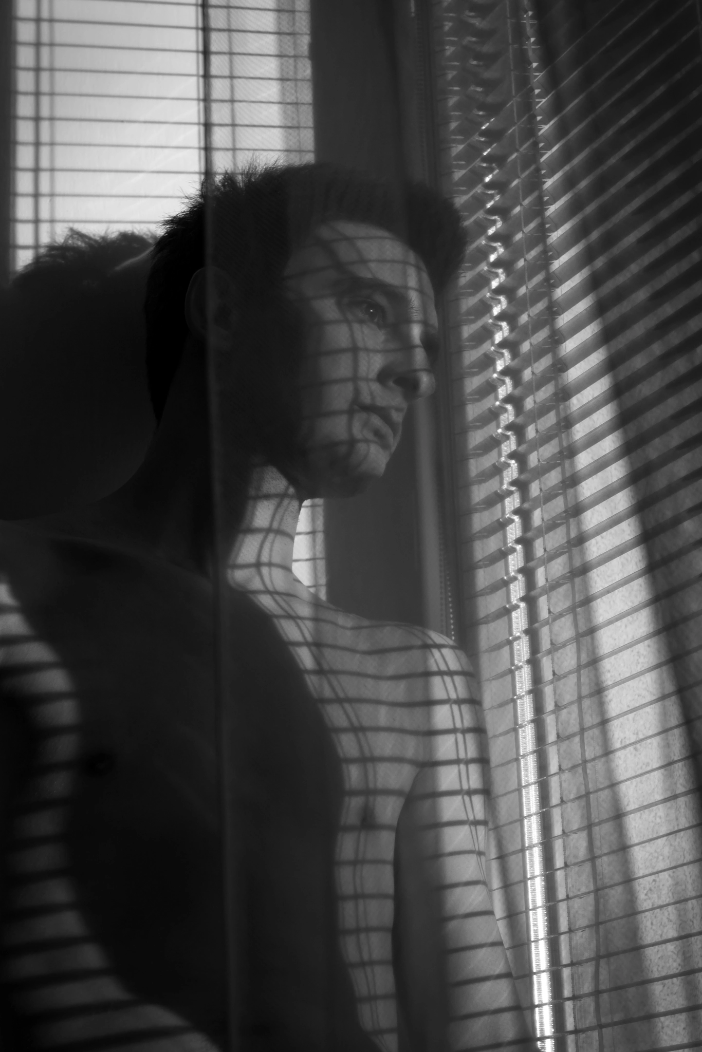 Canon EOS 1100D (EOS Rebel T3 / EOS Kiss X50) sample photo. Young man in the blinds shadow photography