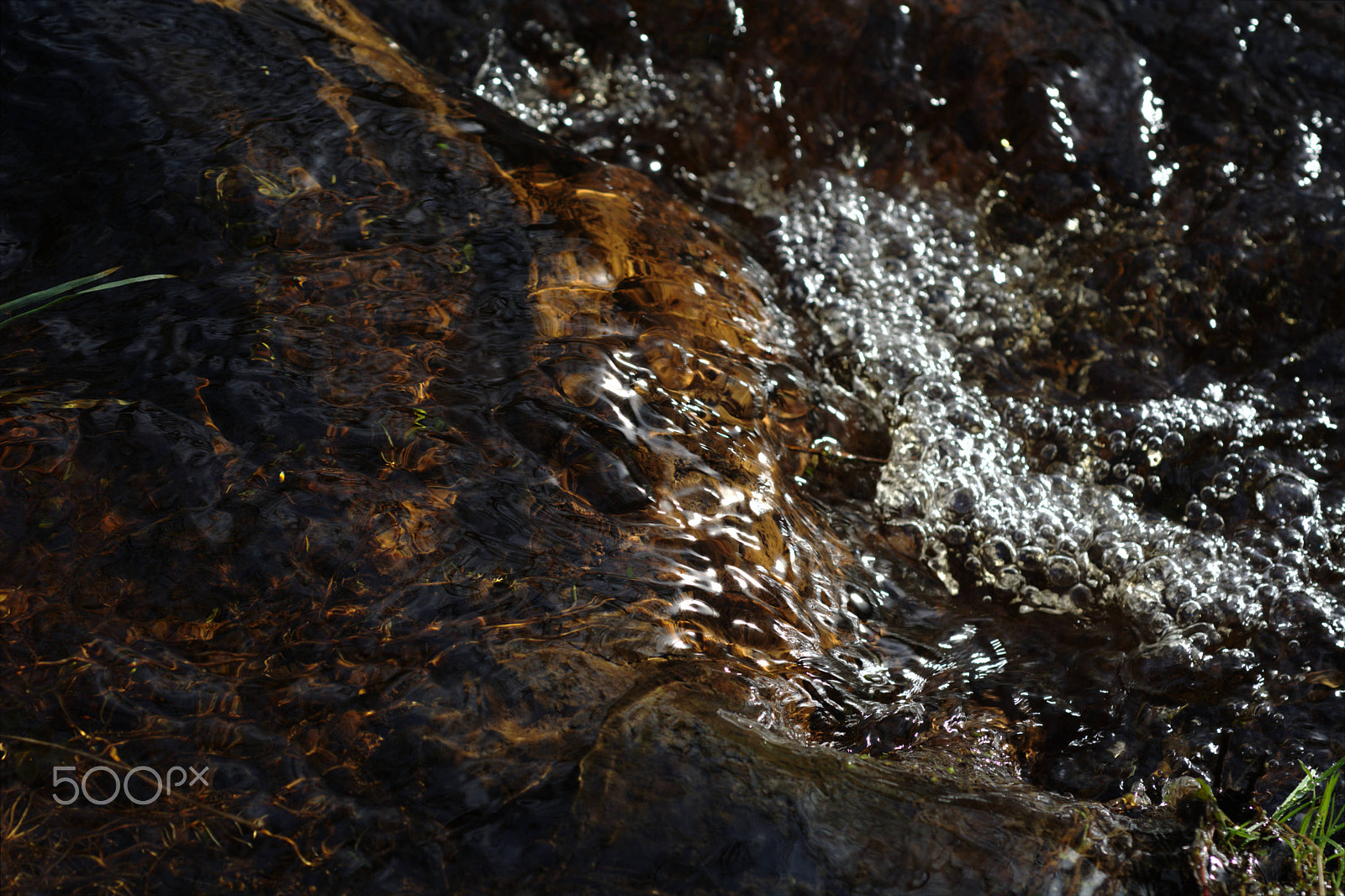 Nikon D7100 + Nikon AF Micro-Nikkor 60mm F2.8D sample photo. Flowing water in a stream with air bubbles photography