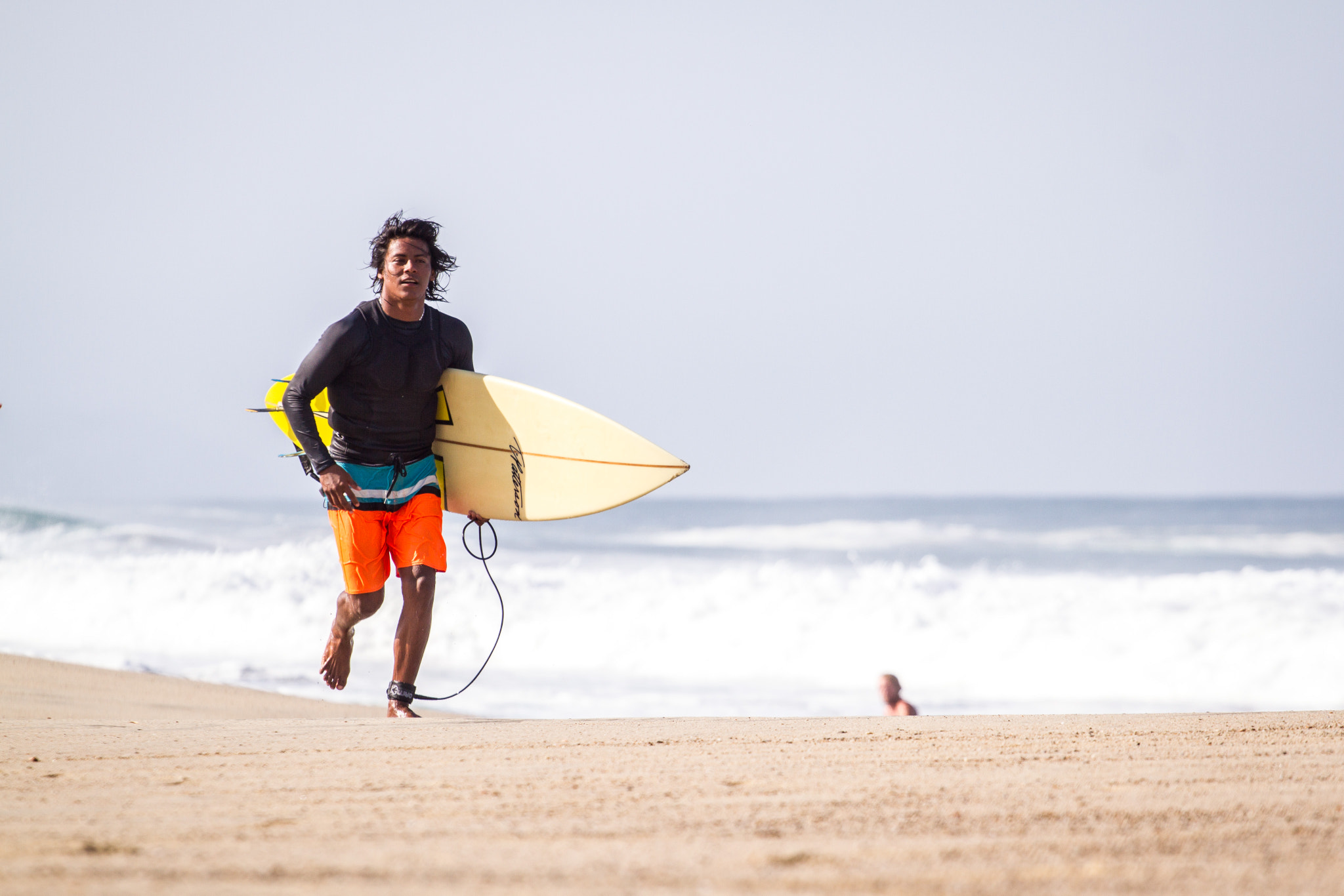 Canon EOS 7D + Canon EF 70-200mm F4L USM sample photo. Local surfer wilber with his surfboard at zicatela beach (puerto escondido) photography