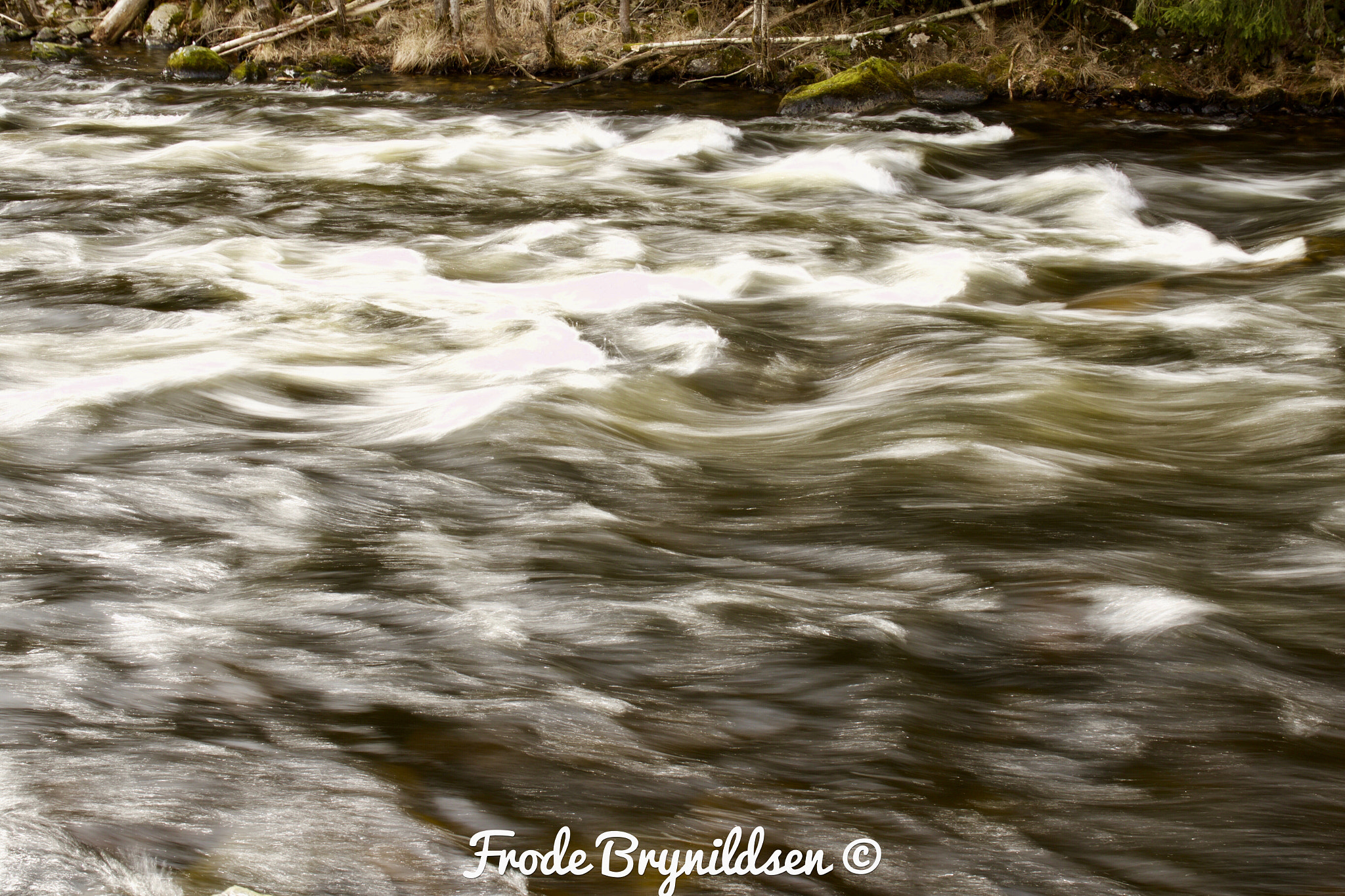 Canon EOS 7D Mark II sample photo. Fast running river. snow and ice is melting. photography