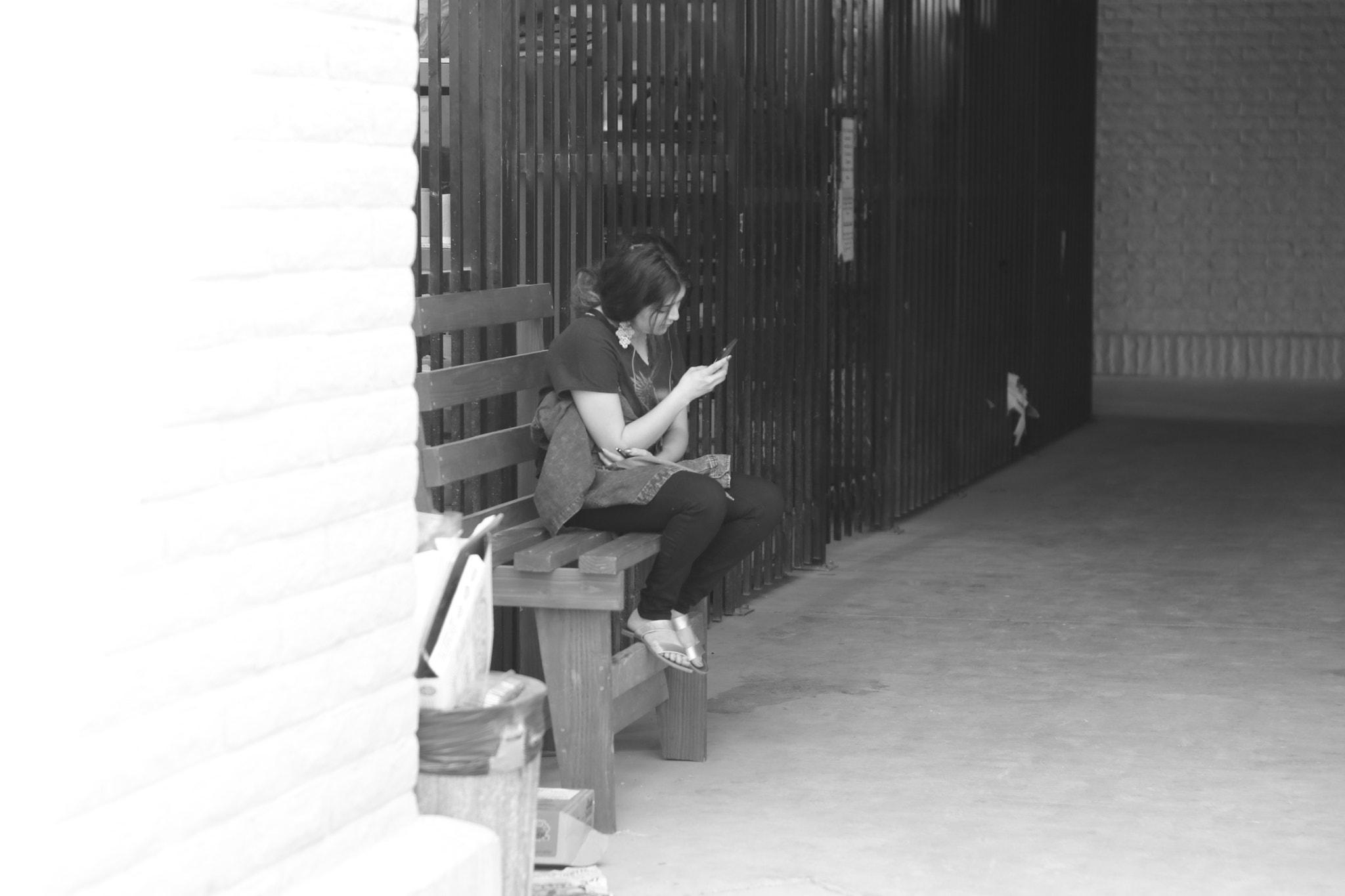 Canon EF 35-80mm f/4-5.6 sample photo. Woman looking at her phone photography