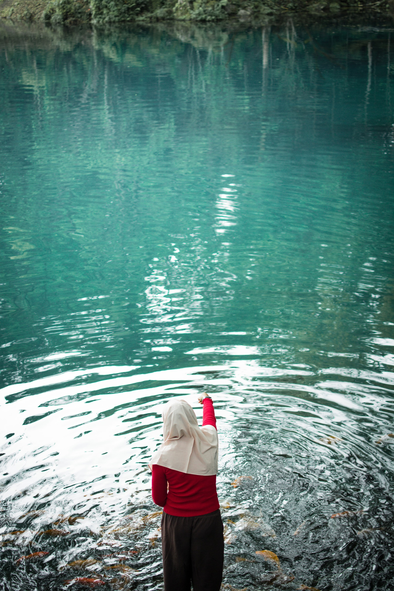 Situ Cicerem at Kuningan , the place that you can see Blue water and many fish .