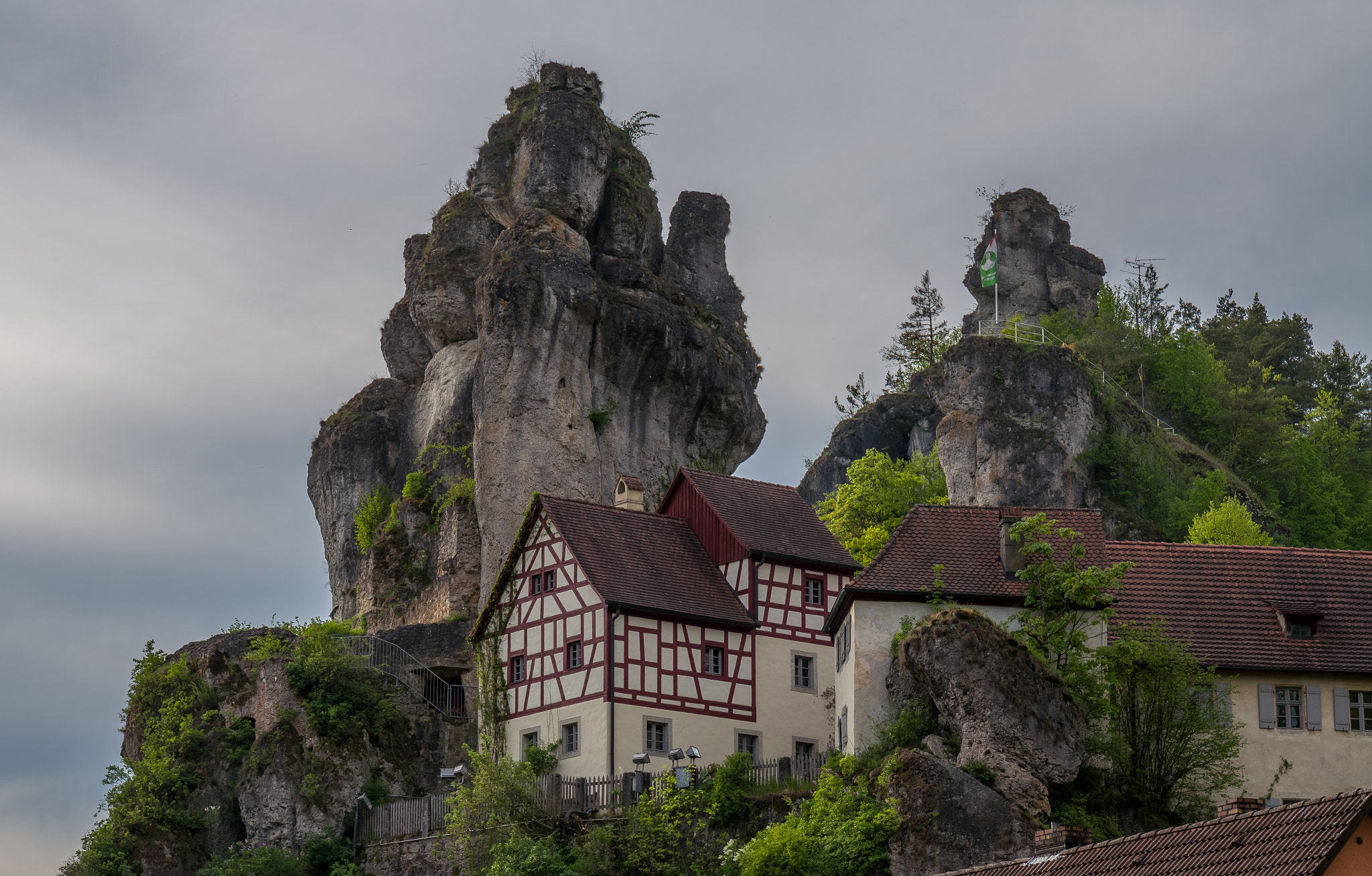 Leica SL (Typ 601) sample photo. Houses near the towering rock photography