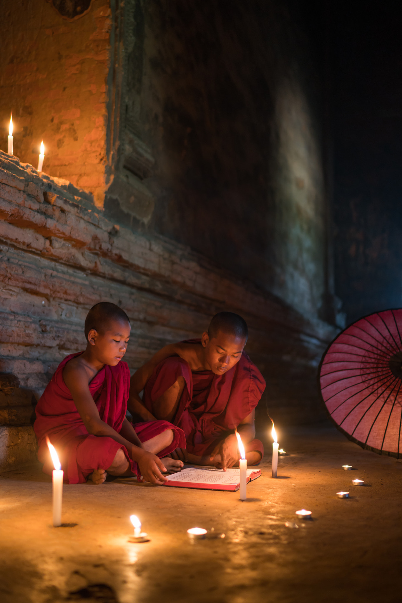 Sony a7R II sample photo. Monks reading scripture book photography