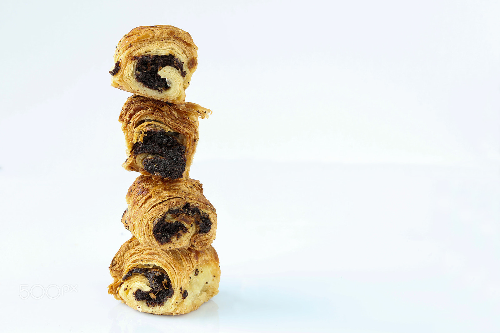 Canon EF 100mm F2.8L Macro IS USM sample photo. Sweet rolls with poppy stand vertically on each other photography