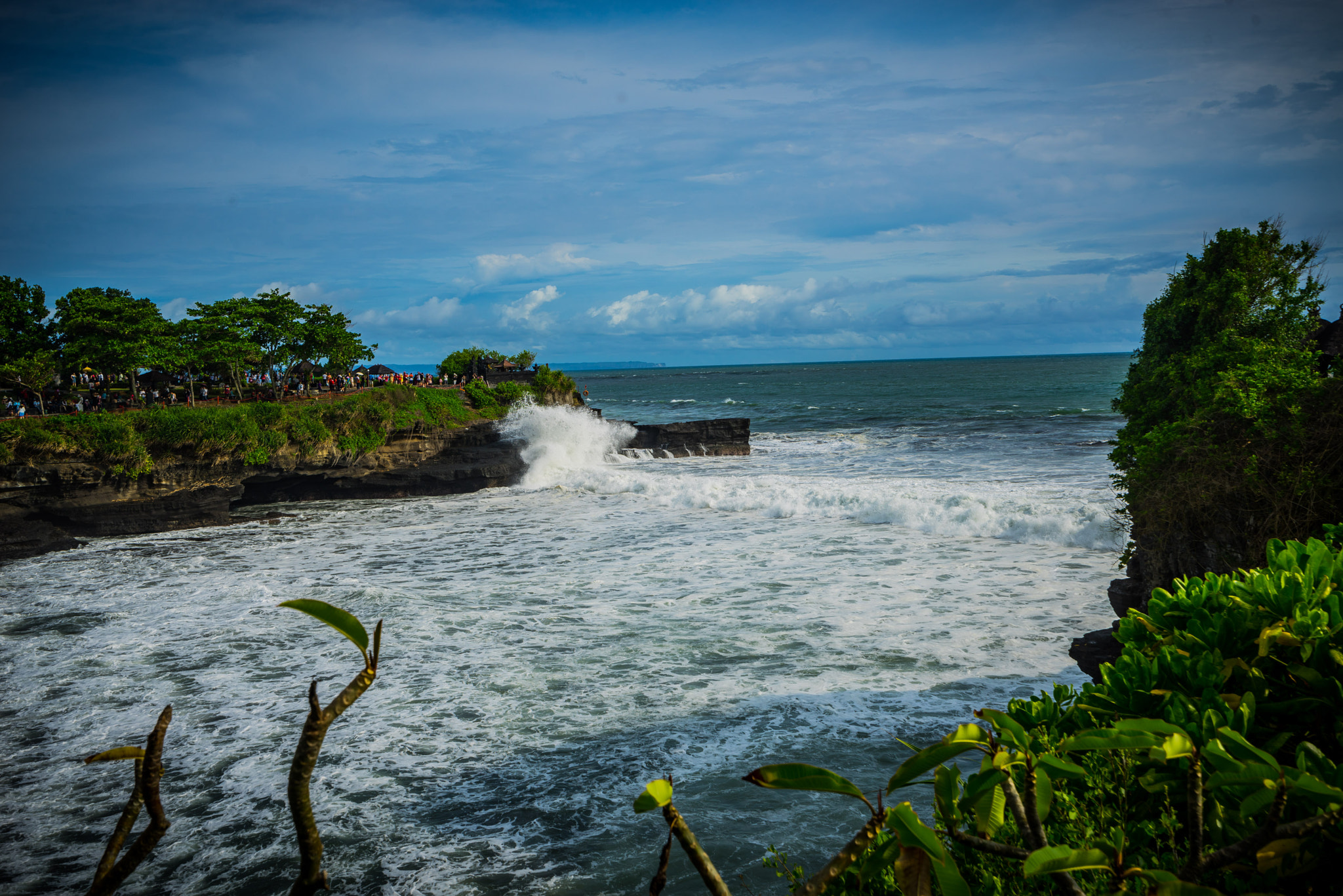 Sony a7R sample photo. Tanah lot with high tide and lots of water photography