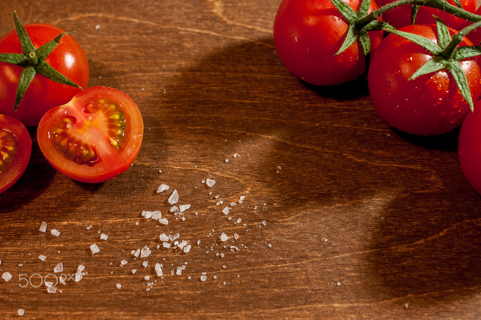 Canon EOS 500D (EOS Rebel T1i / EOS Kiss X3) + Canon EF 40mm F2.8 STM sample photo. Fresh ripe cherry tomatoes on wooden background photography