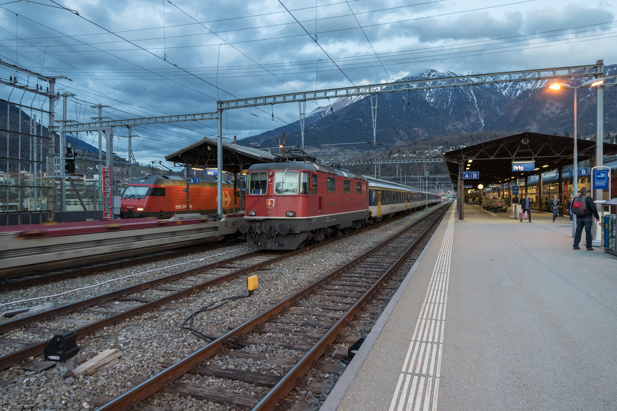 Canon EOS 7D Mark II sample photo. Brig train station with passing freight train photography