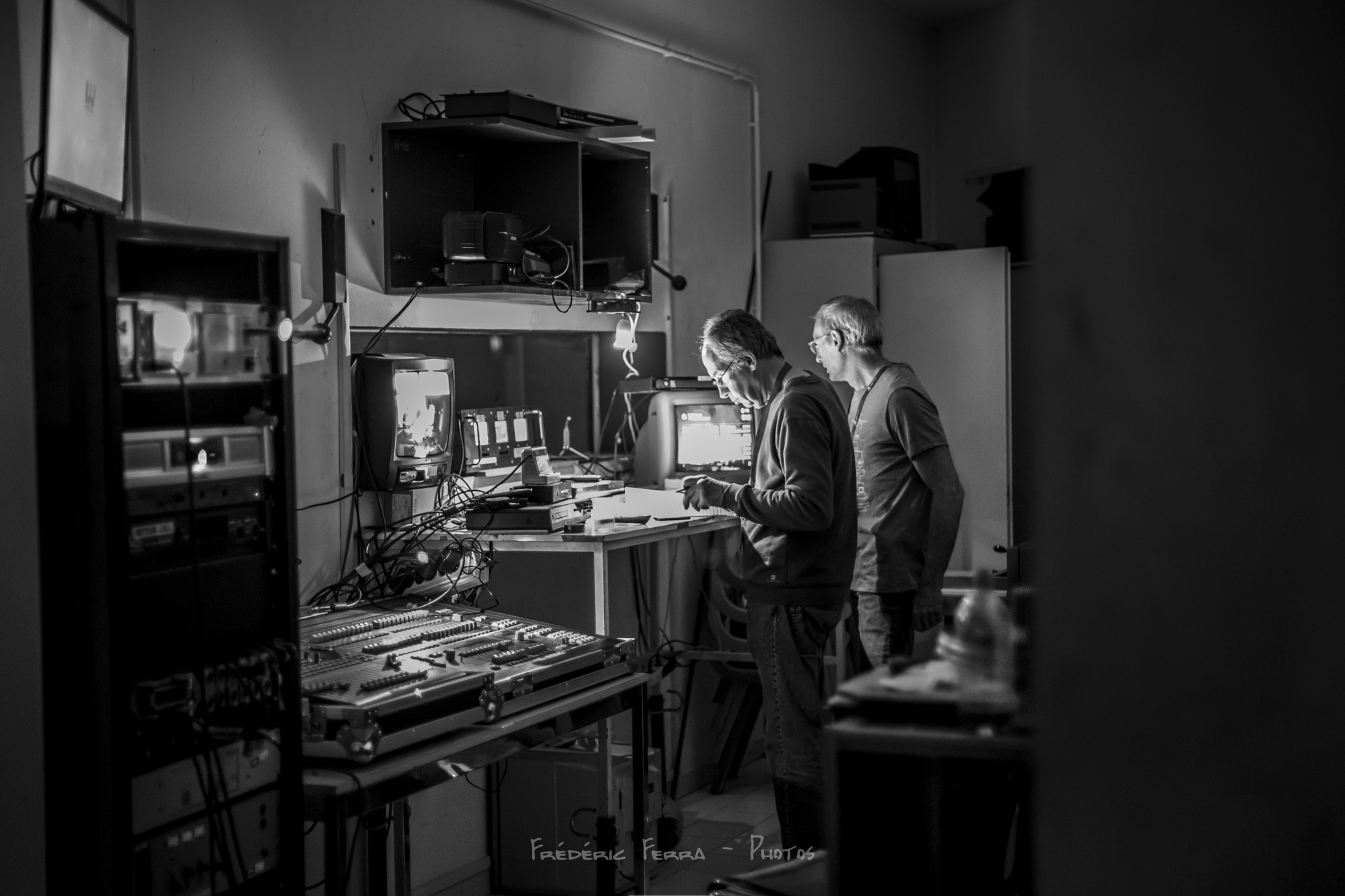 Canon EF 50mm F1.4 USM sample photo. Two men prepare a movie projection photography