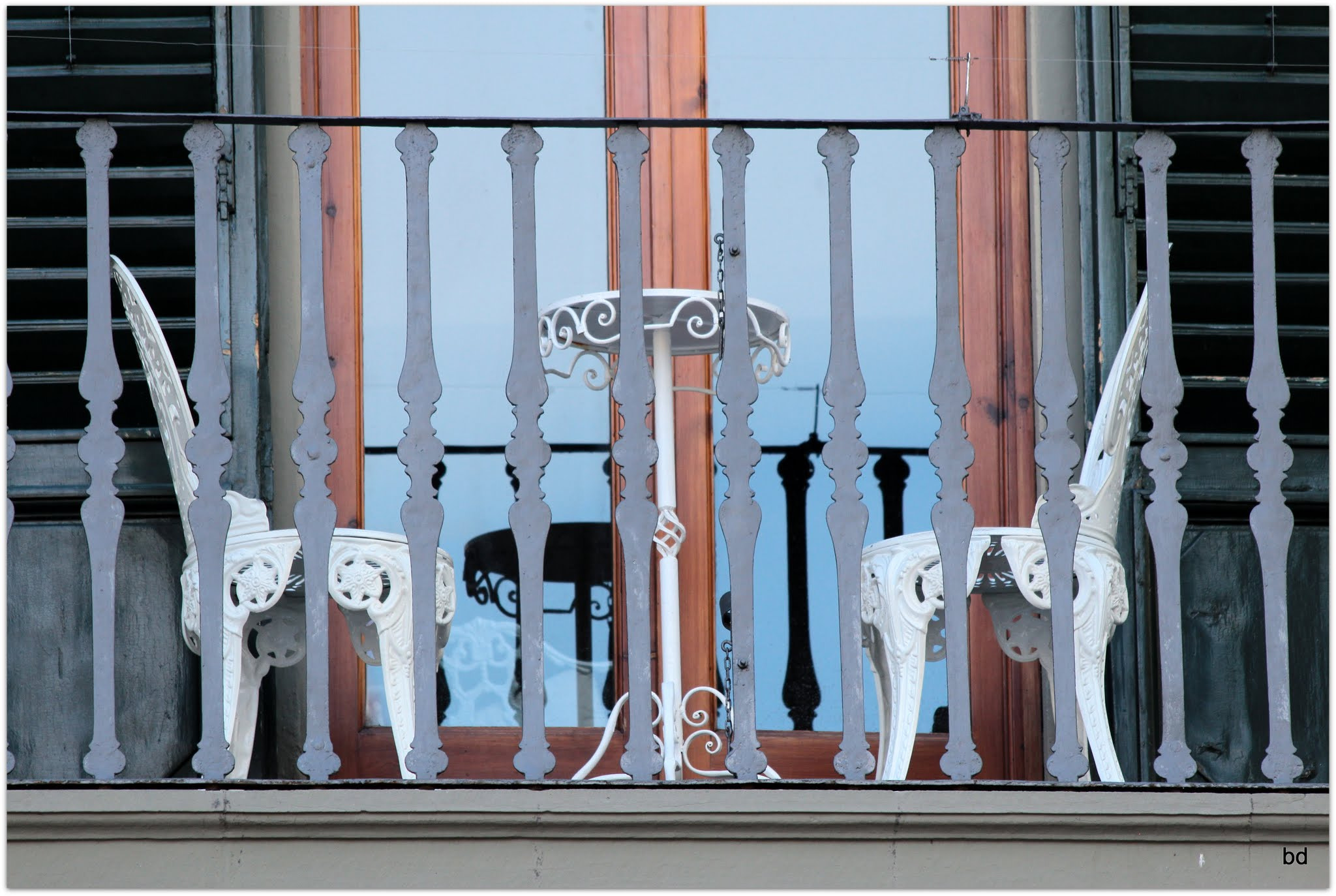 Canon EF 70-300mm F4-5.6 IS USM sample photo. "two chairs and a table on the balcony" photography