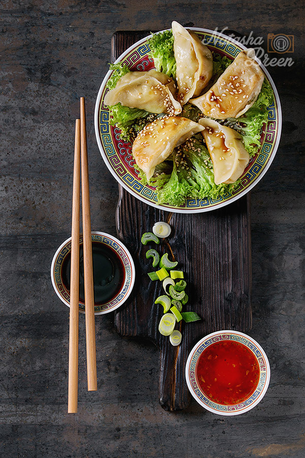 Canon EOS 700D (EOS Rebel T5i / EOS Kiss X7i) + Canon EF 70-200mm F4L IS USM sample photo. Gyozas potstickers with sauces photography