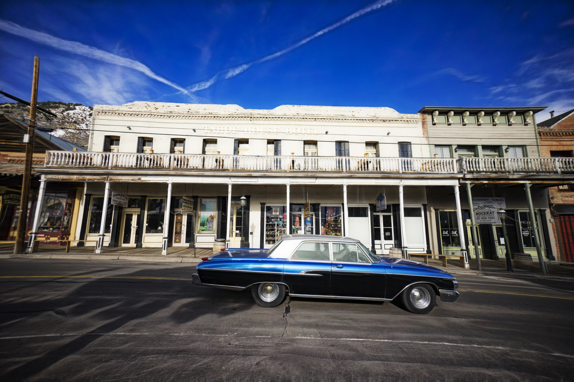 Sony E 10-18mm F4 OSS sample photo. Blue car blue sky photography