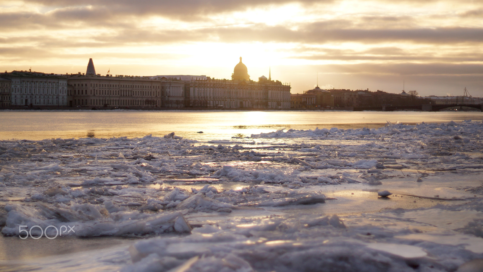 Sony SLT-A65 (SLT-A65V) sample photo. View of an ice-covered river and city sunset on the other side photography