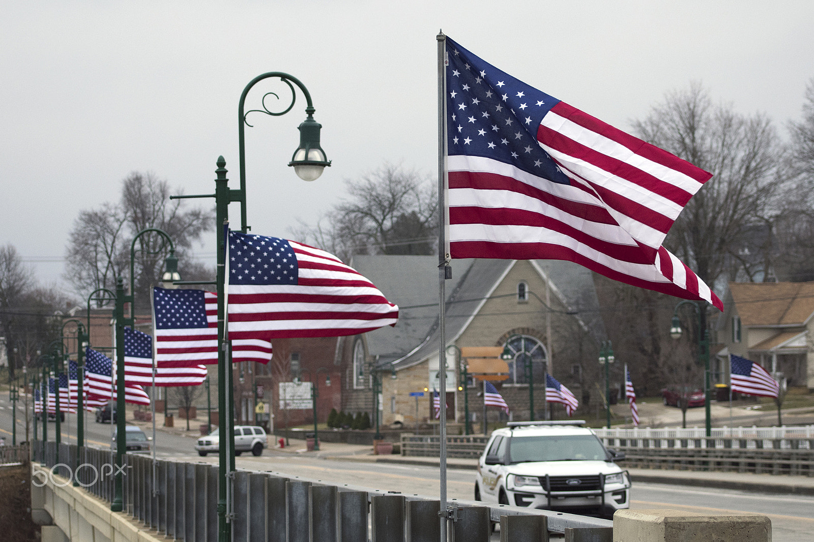 Nikon AF-S Nikkor 70-200mm F2.8G ED VR II sample photo. Flags on bridge street photography