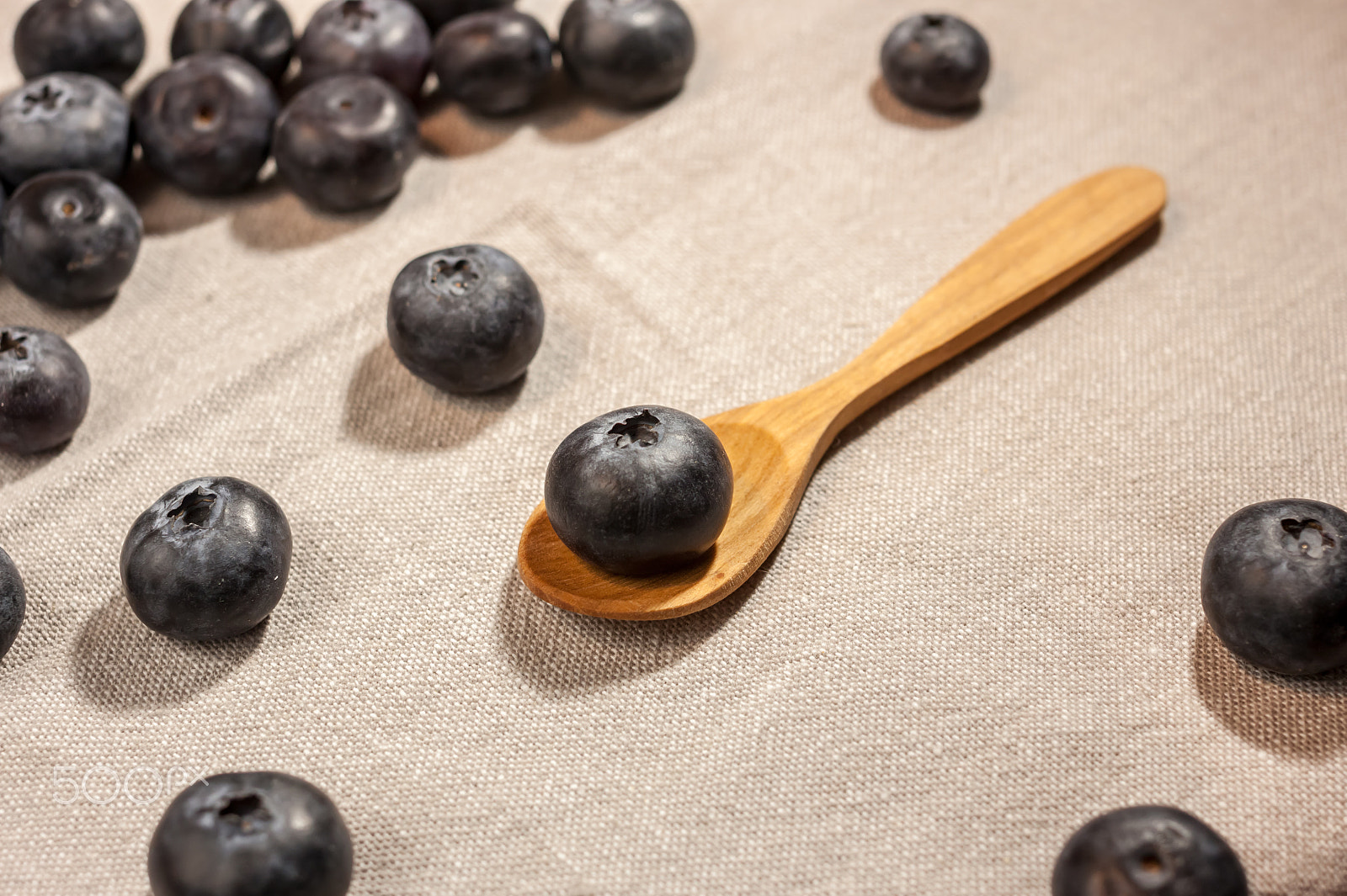 Canon EOS 500D (EOS Rebel T1i / EOS Kiss X3) sample photo. Big blueberry in wooden spoon photography
