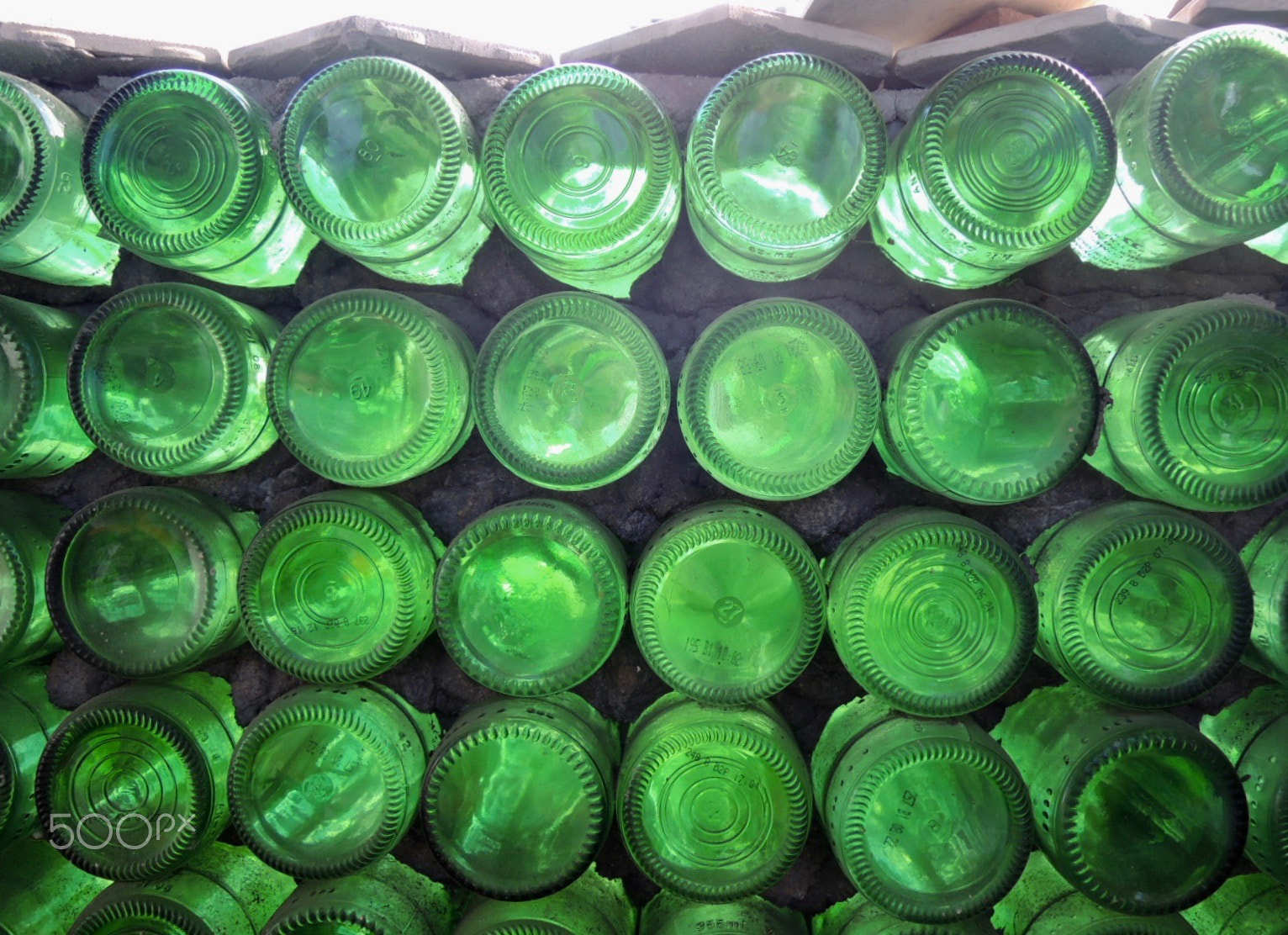 Nikon Coolpix P310 sample photo. Green bottle bottoms photography