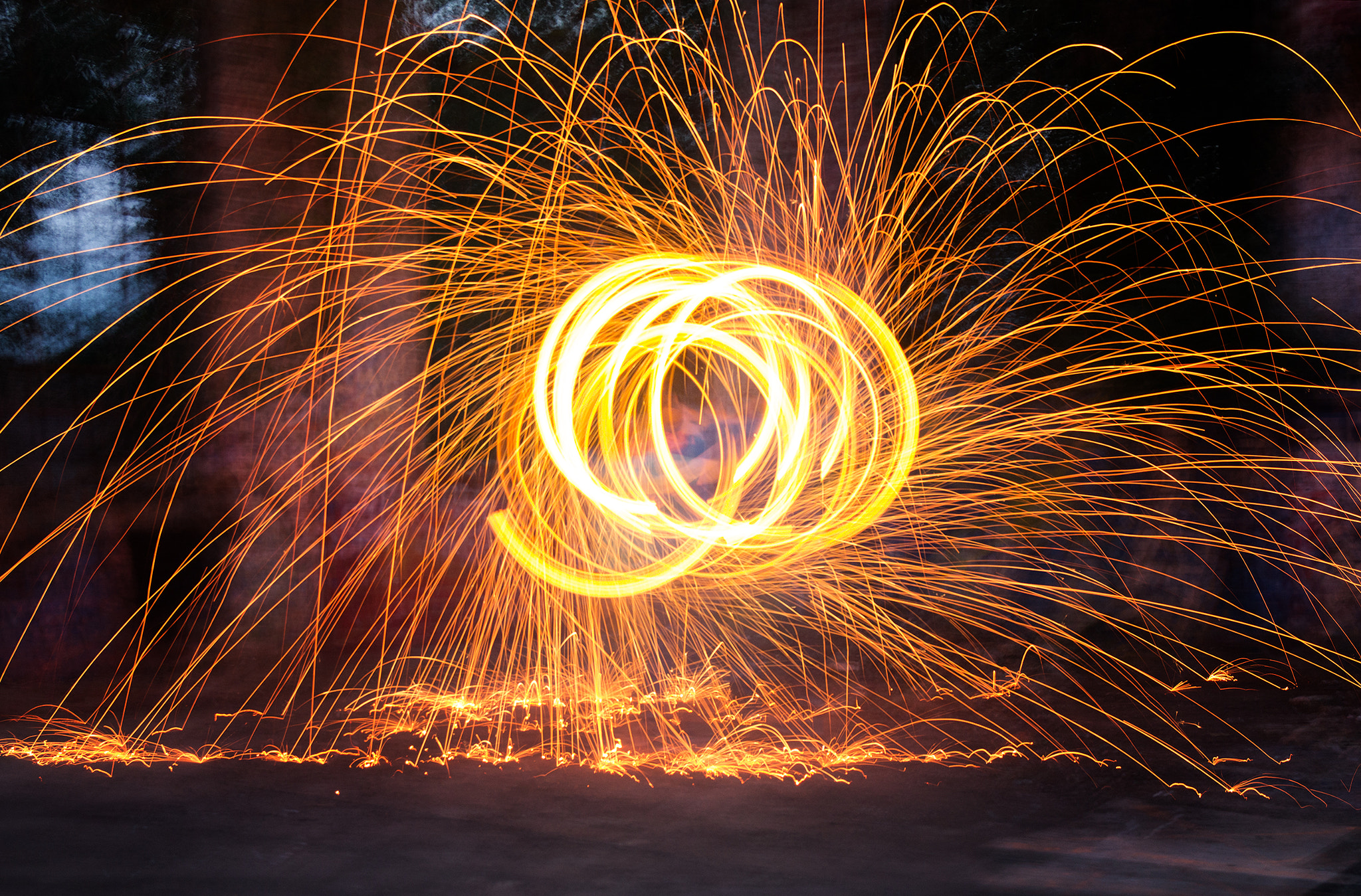 Canon EF-S 17-55mm F2.8 IS USM sample photo. Fiery trails of burning steel photography