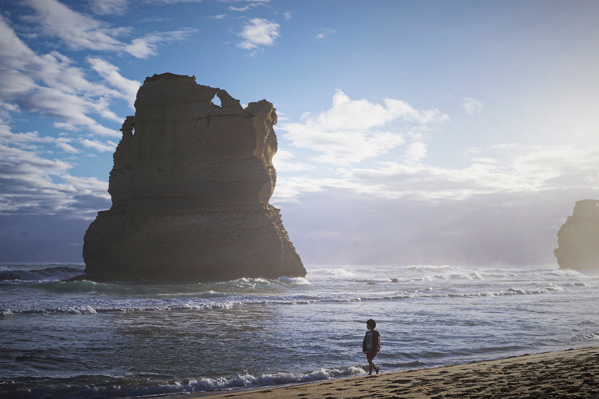 ZEISS Loxia 50mm F2 sample photo. Baby  walking on the beach photography