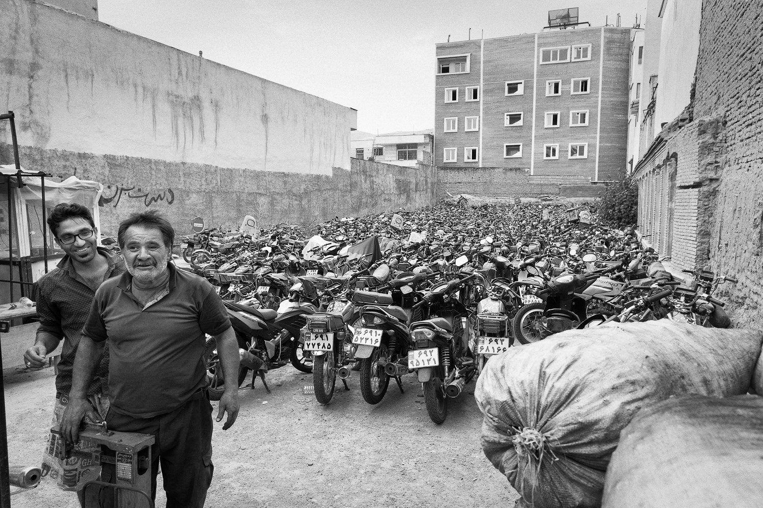 Canon EOS-1D X sample photo. Motorcycle impoundment lot in shiraz, iran photography