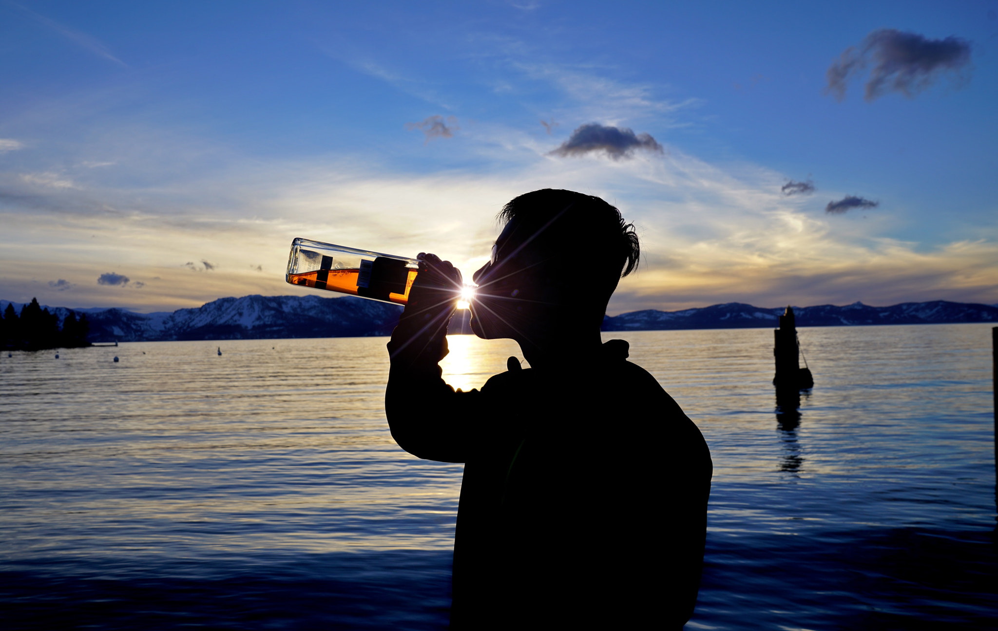 Sony FE 24-70mm F2.8 GM sample photo. My friend have some whiskey at sunset in south lake tahoe over the weekend. photography