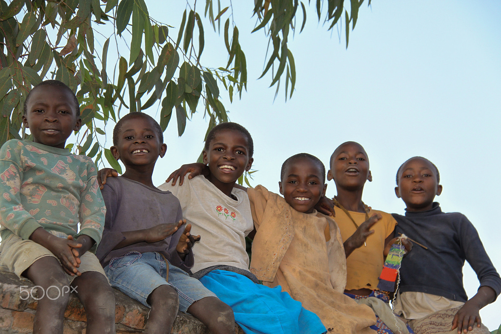 Canon EOS 50D sample photo. Rwandan children sitting on a wall photography