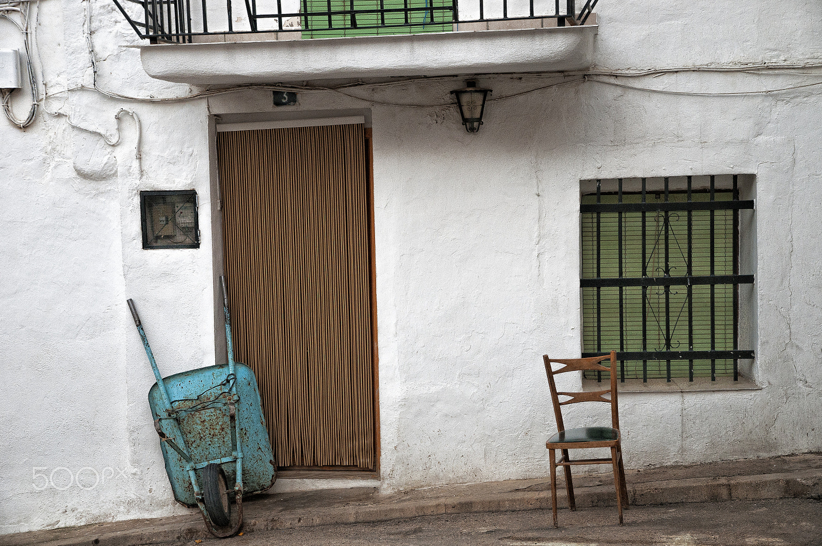 Nikon D300 sample photo. Facade of village house with wheelbarrow and chair photography