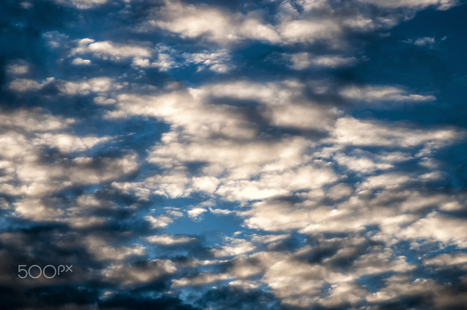Nikon D300 sample photo. Clouds lit by the last rays of sun at dusk photography