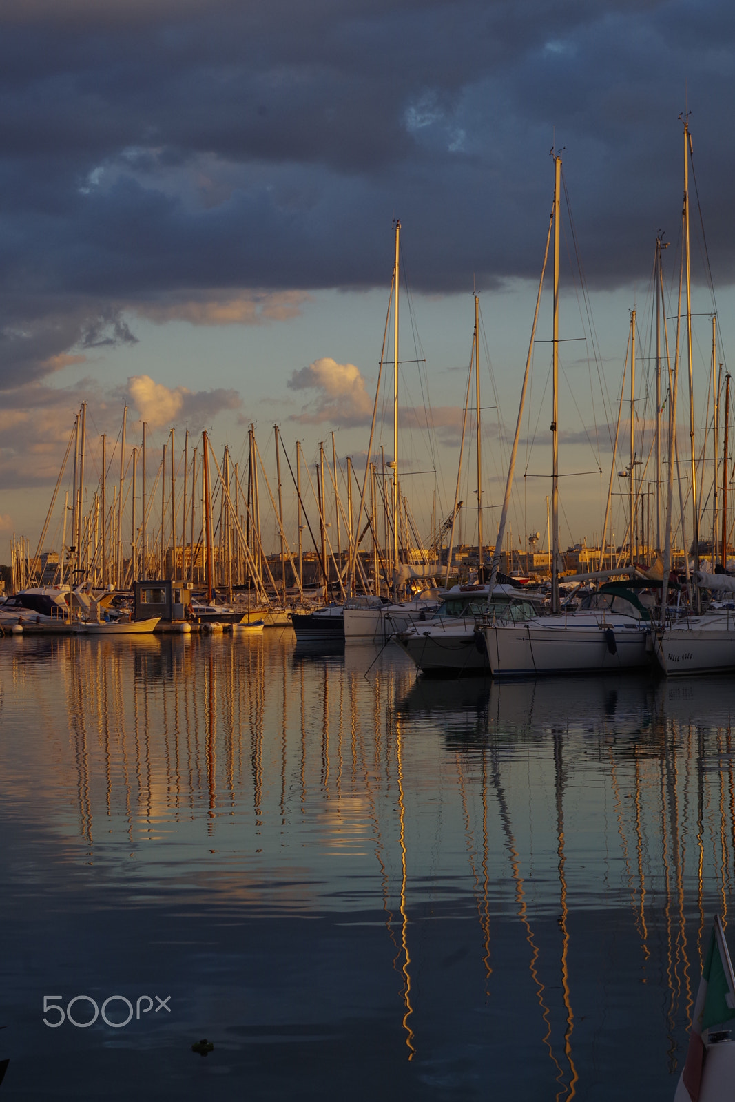 Pentax K-S2 sample photo. Sail boats in a yellow light in a rainy day photography